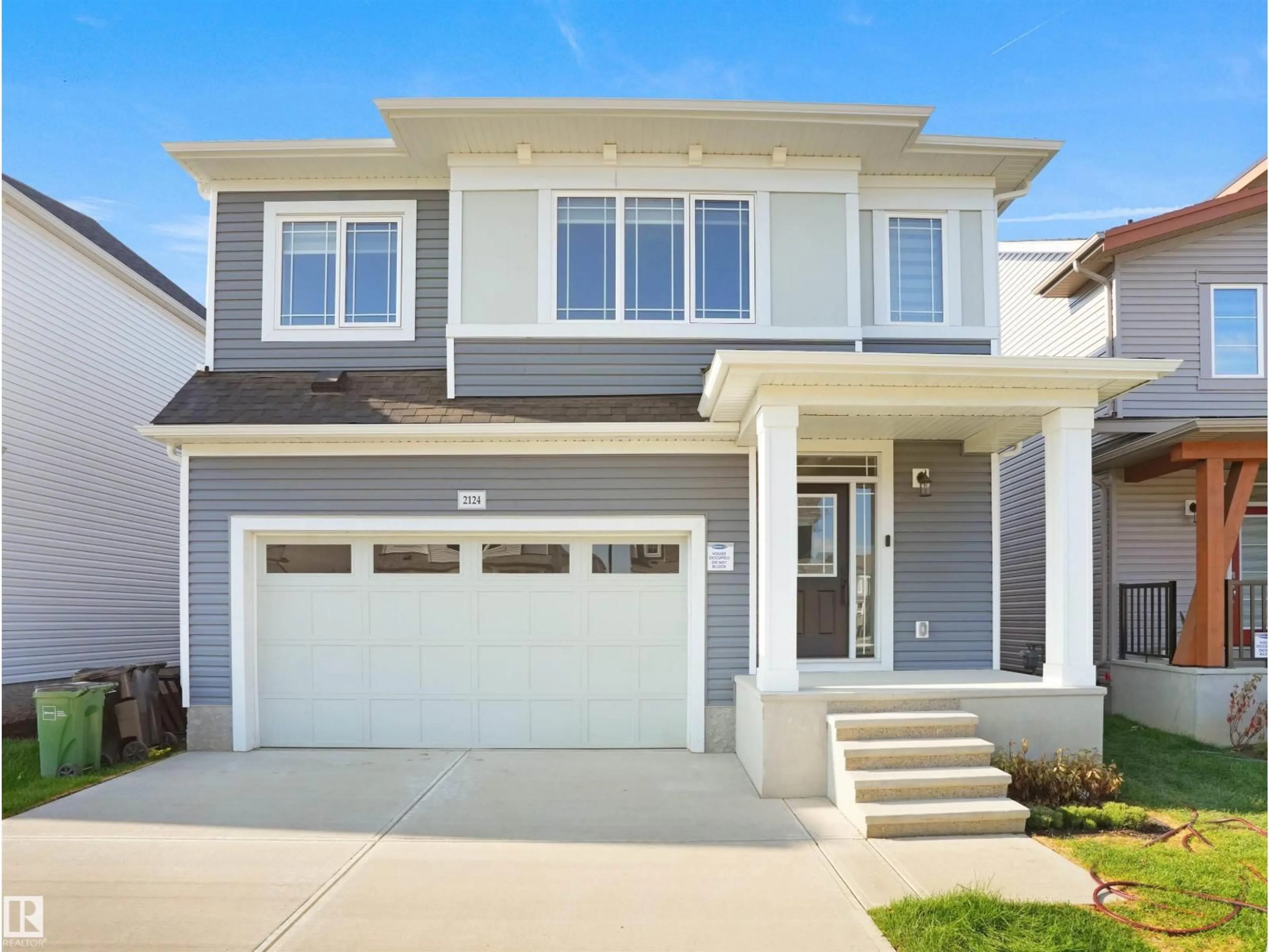 Home with vinyl exterior material, street for NW - 2124 209 ST, Edmonton Alberta T6M2X6