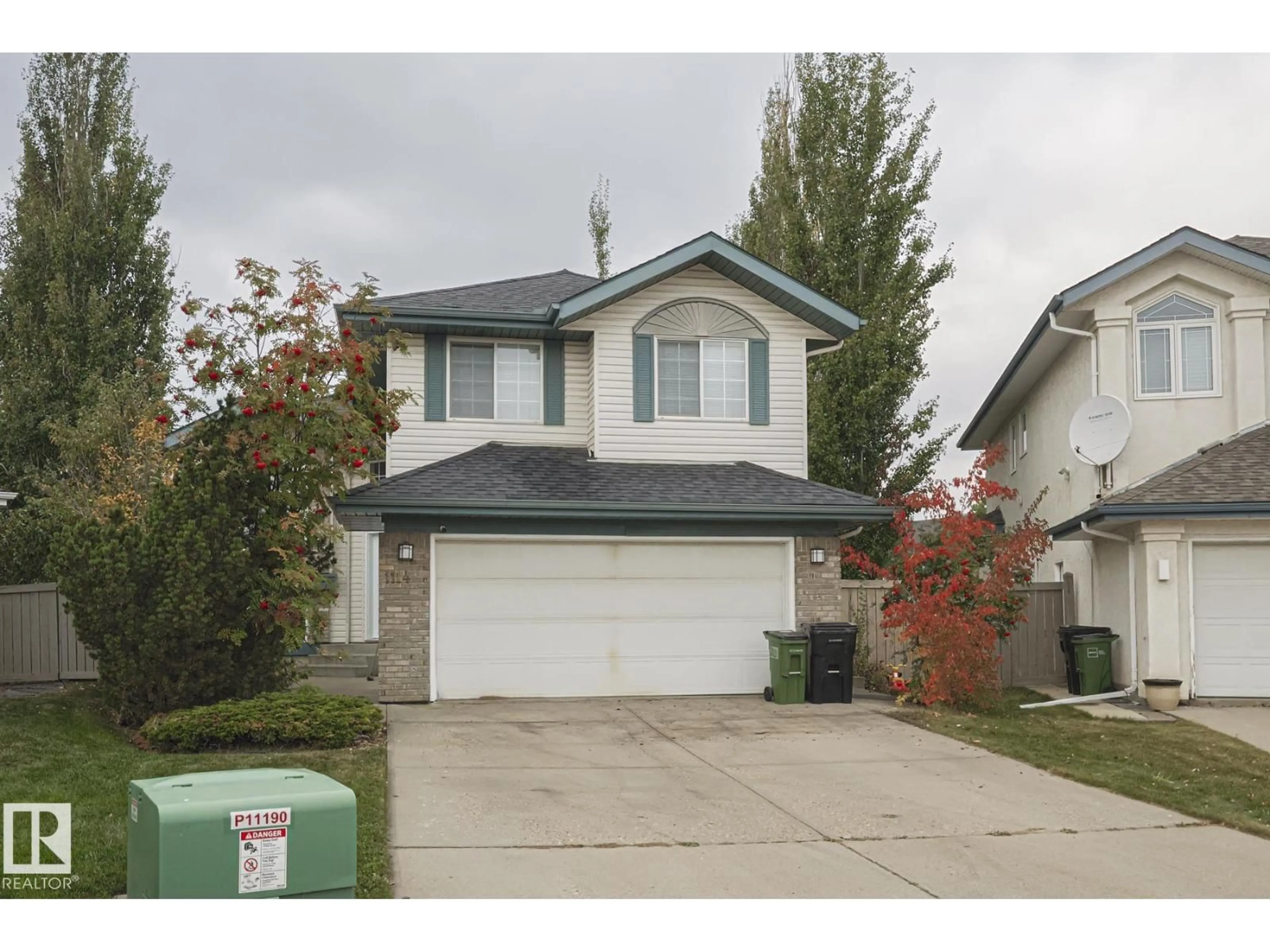 Home with vinyl exterior material, street for NW - 1114 116 ST, Edmonton Alberta T6J6Y3