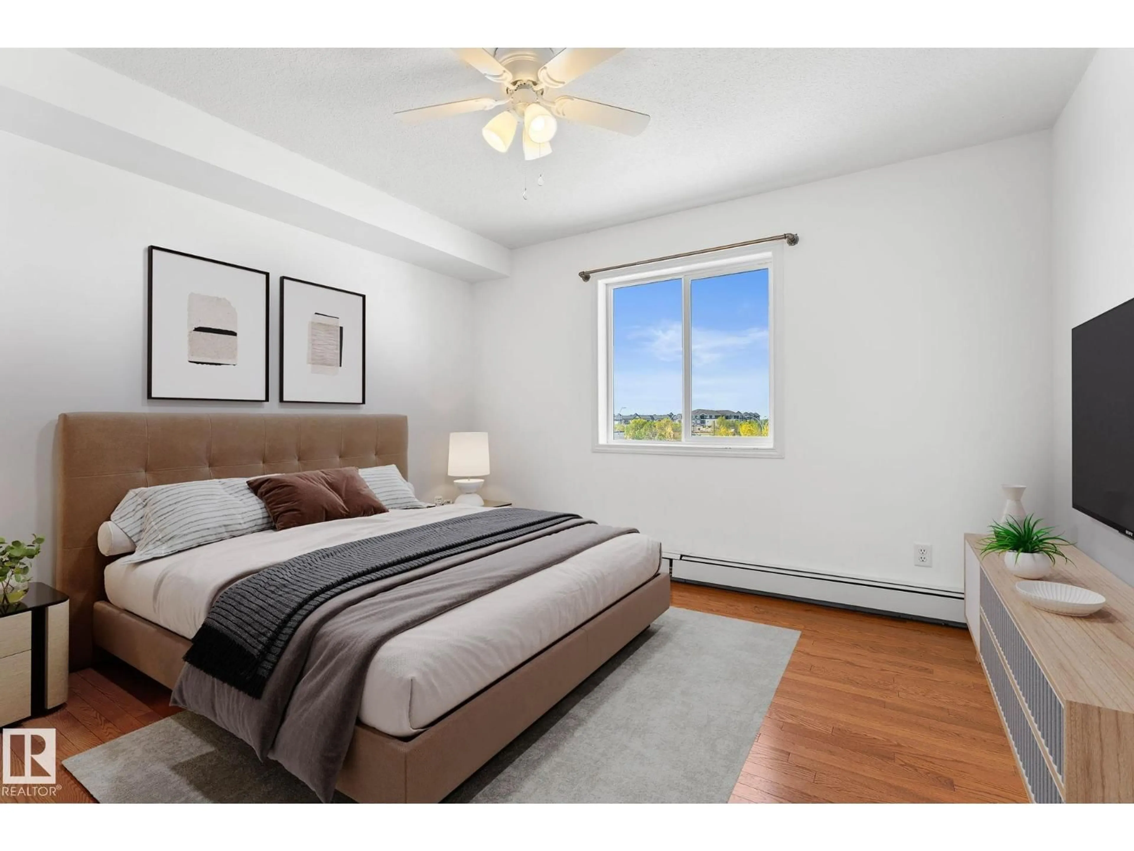 Bedroom with bed, wood/laminate floor for 420 12550 140 AV NW, Edmonton Alberta T5X6J4