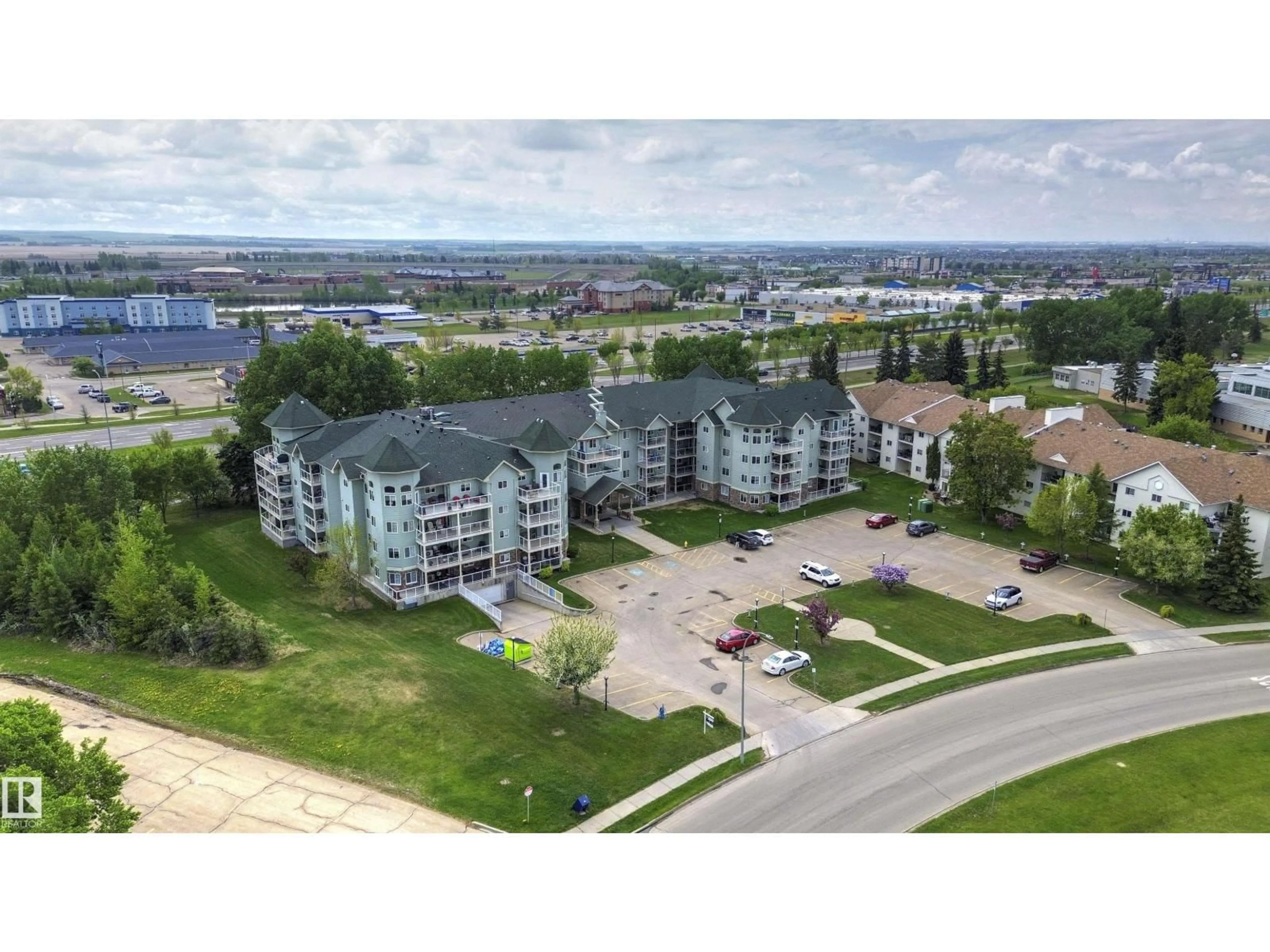 A pic from outside/outdoor area/front of a property/back of a property/a pic from drone, water/lake/river/ocean view for #305 - 9995 93 AV, Fort Saskatchewan Alberta T8L1N5
