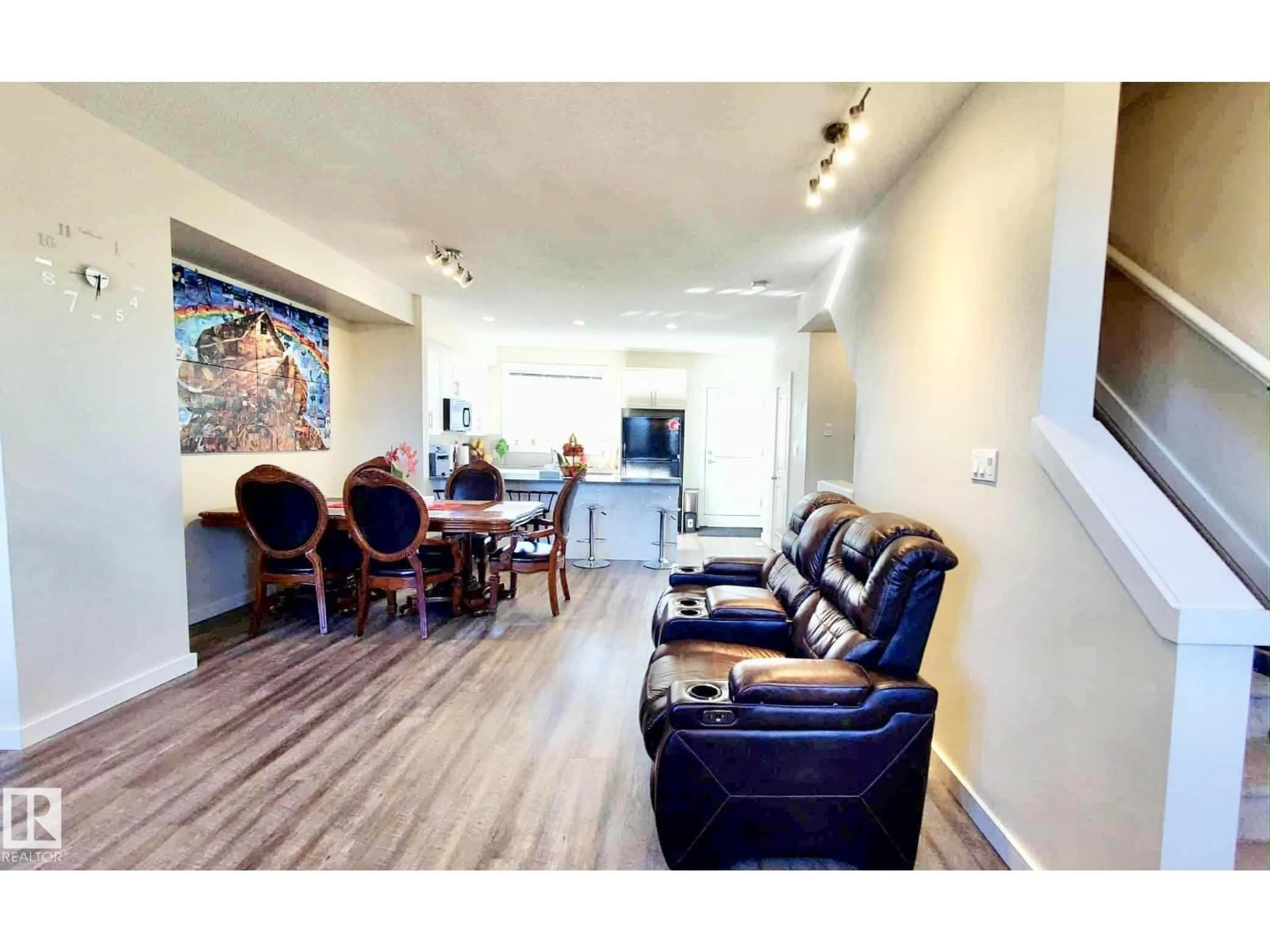 Living room with furniture, wood/laminate floor for 903 - 36 CRYSTALLINA NERA WY, Edmonton Alberta T5Z0N6