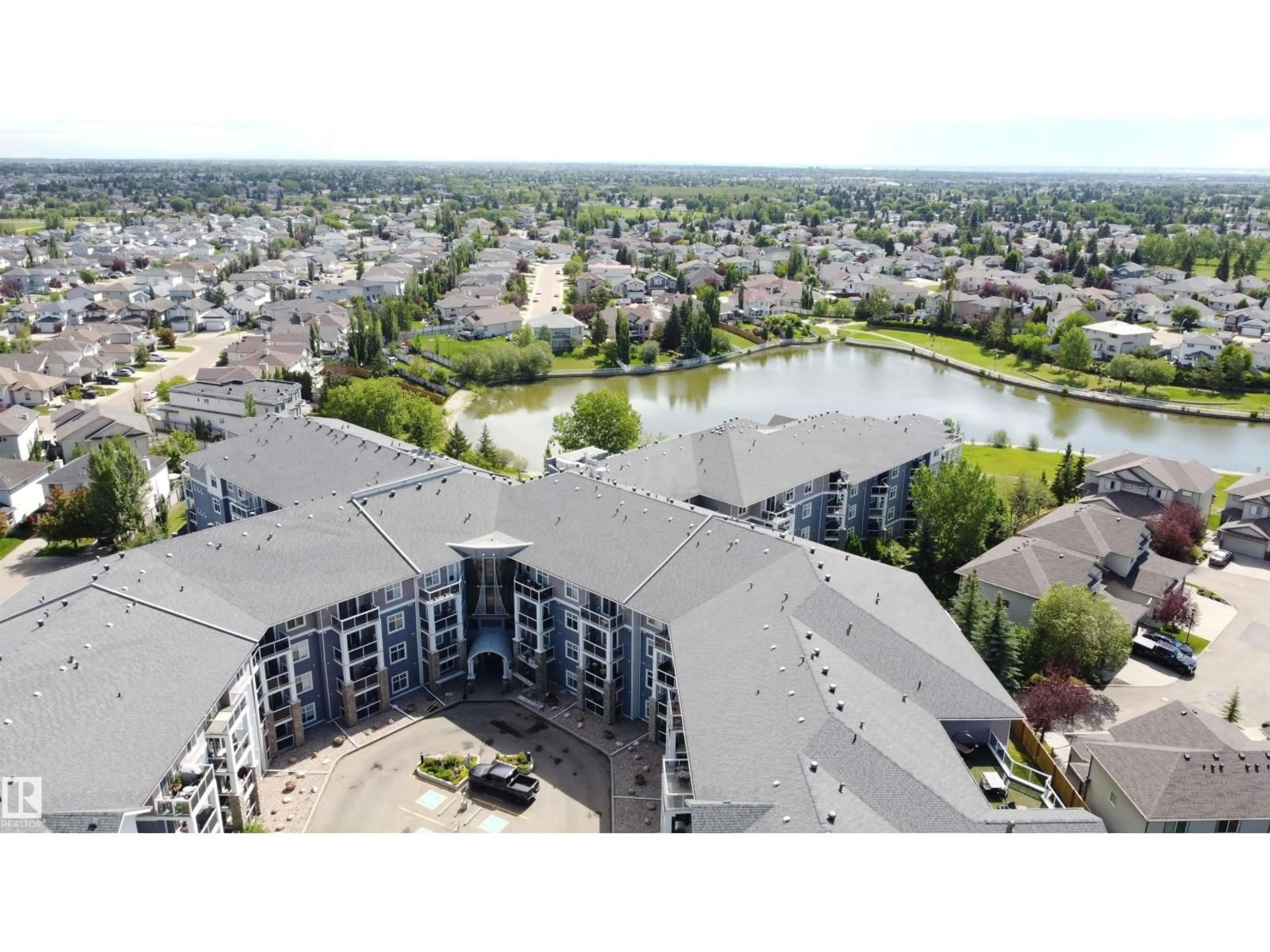 A pic from outside/outdoor area/front of a property/back of a property/a pic from drone, mountain view for #209 - 16035 132 ST NW, Edmonton Alberta T6V0B4