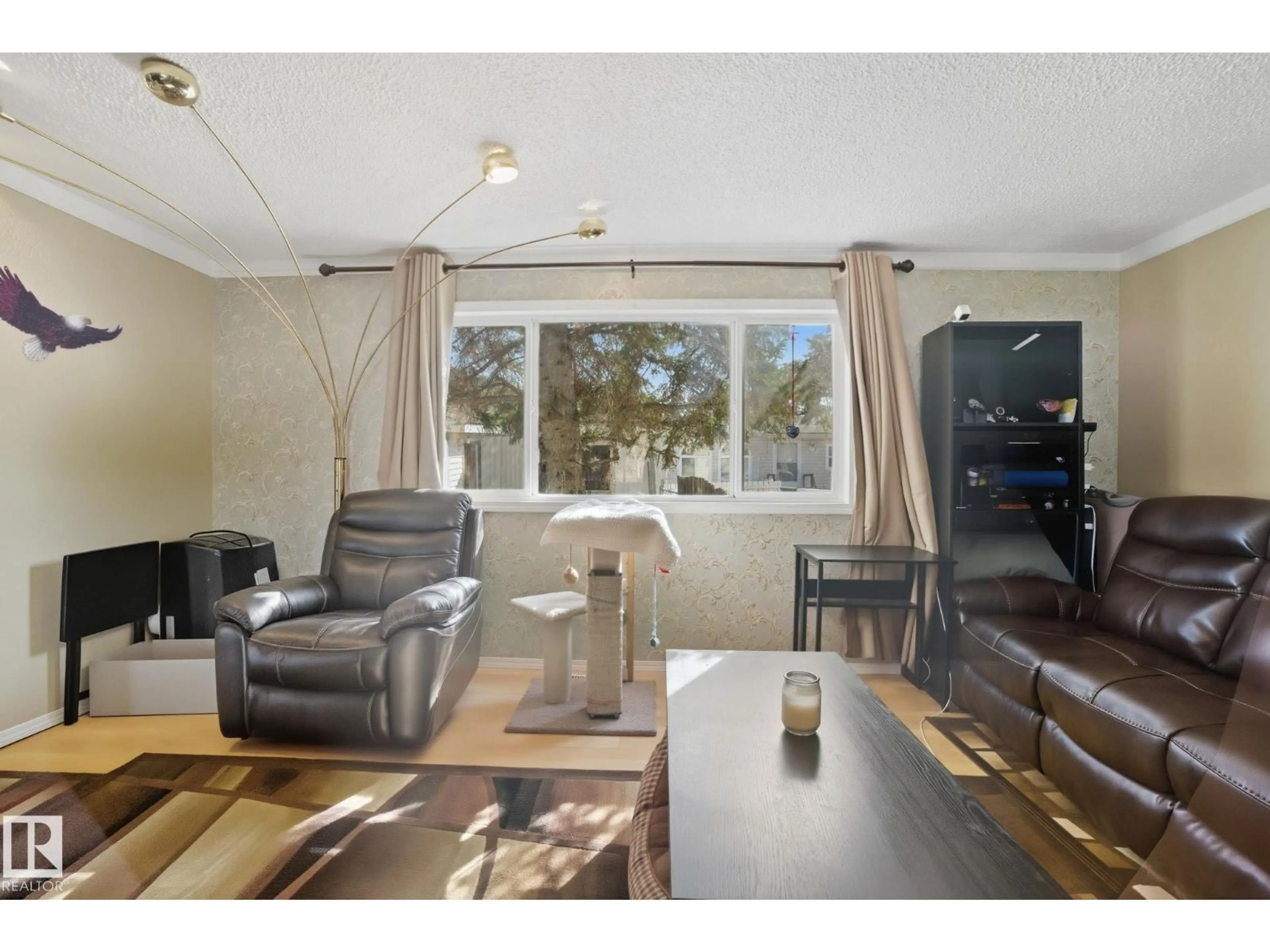 Living room with furniture, wood/laminate floor for 117 RANGE ROAD 272, Rural Parkland County Alberta T7X3N6