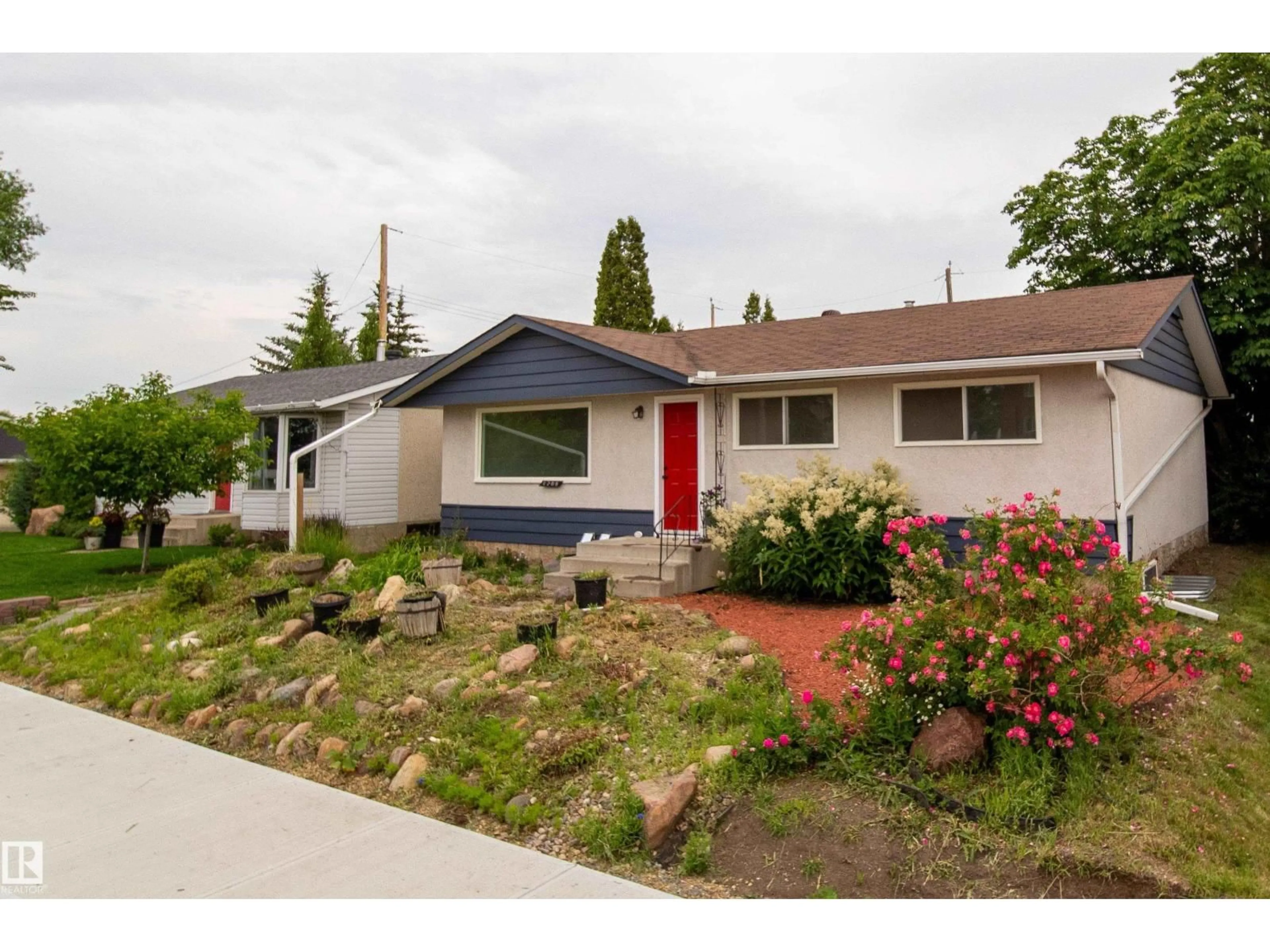 Home with vinyl exterior material, street for 6708 132 AV, Edmonton Alberta T5C2A5