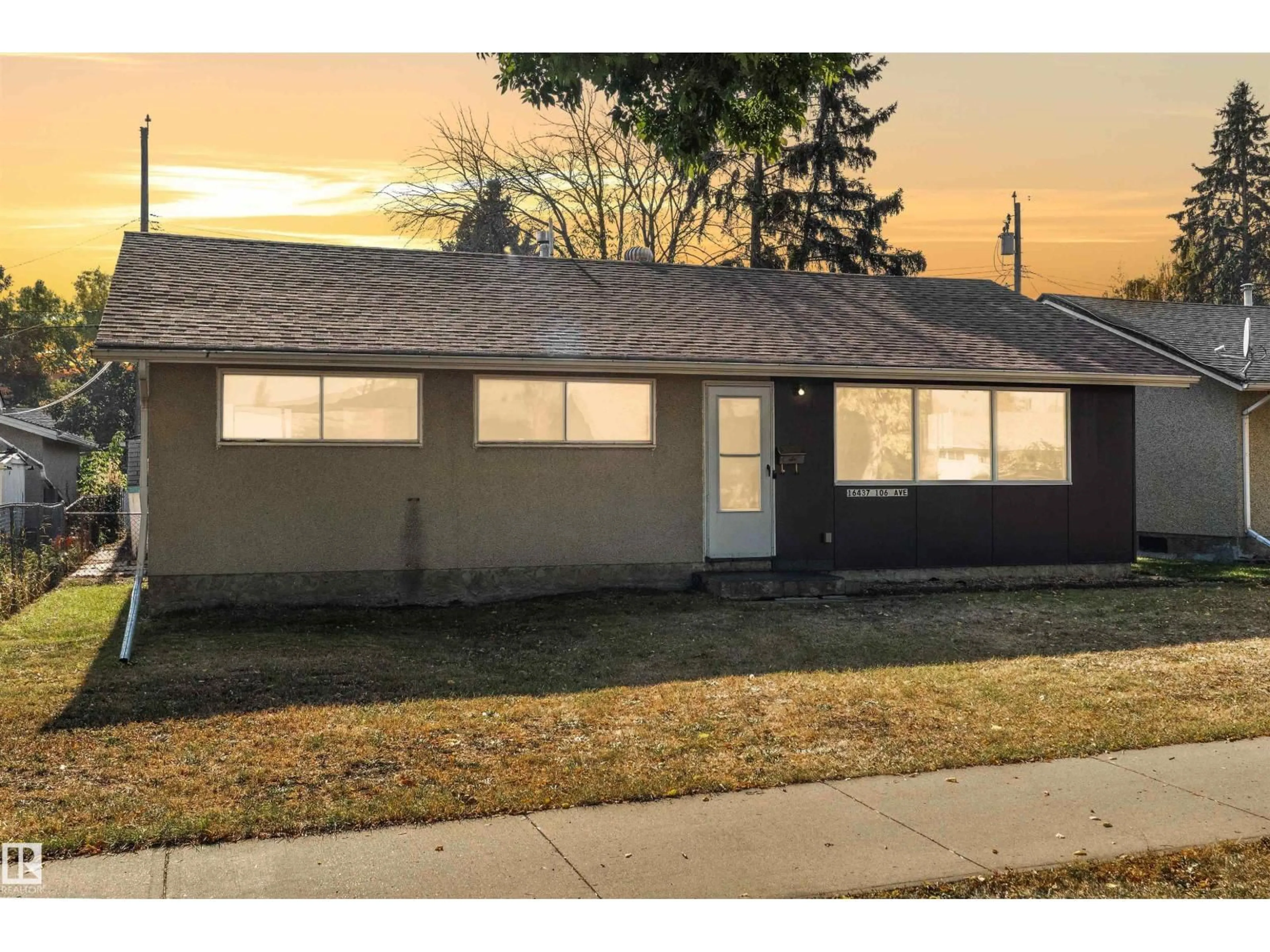 Home with vinyl exterior material, street for 16437 106 AV, Edmonton Alberta T5P0X1