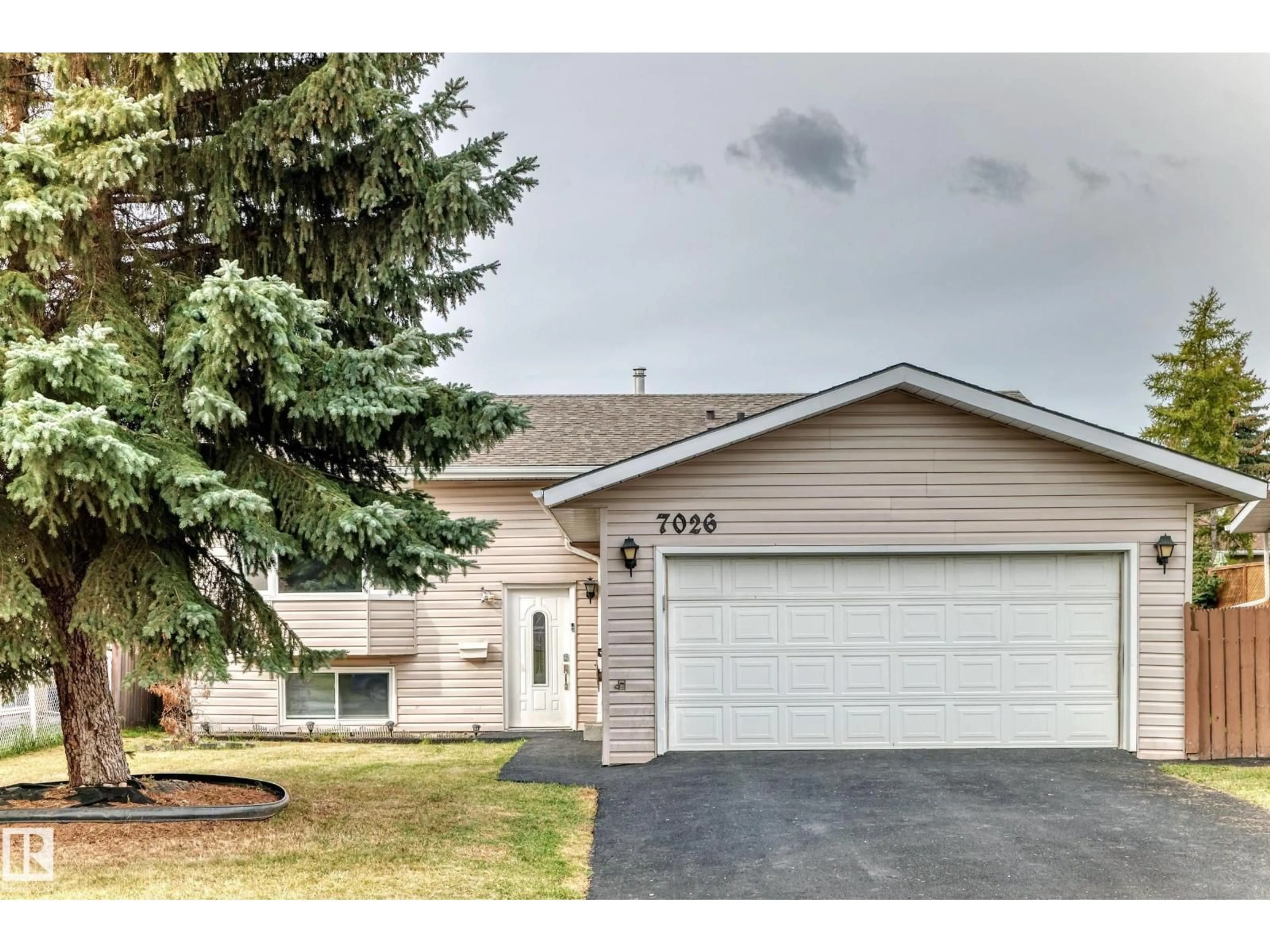Home with vinyl exterior material, street for 7026 11 AV, Edmonton Alberta T6K3J5