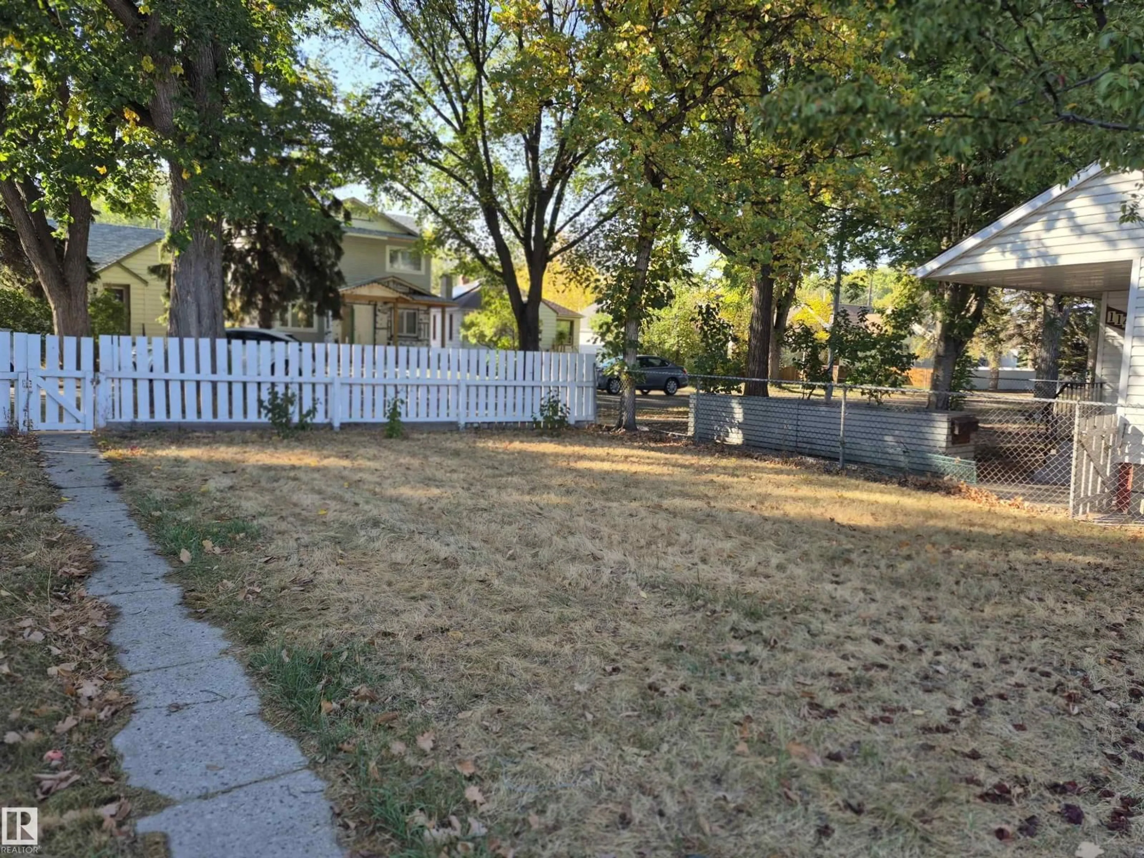 A pic from outside/outdoor area/front of a property/back of a property/a pic from drone, street for 11421 83 ST, Edmonton Alberta T5B2Y4