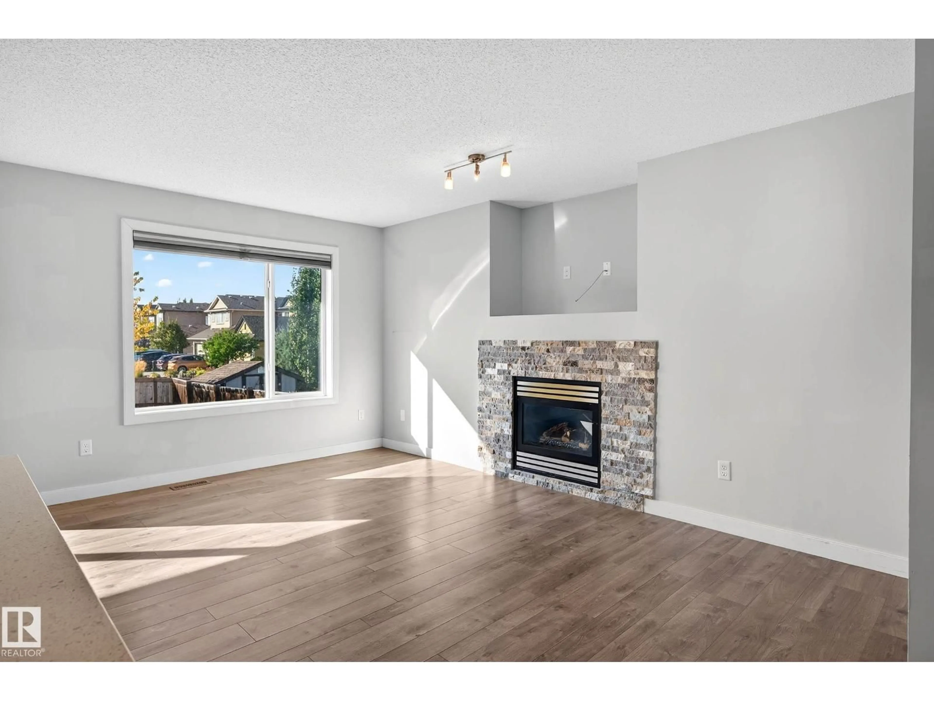 Living room with furniture, wood/laminate floor for 6019 SUNBROOK LD, Sherwood Park Alberta T8H0J5