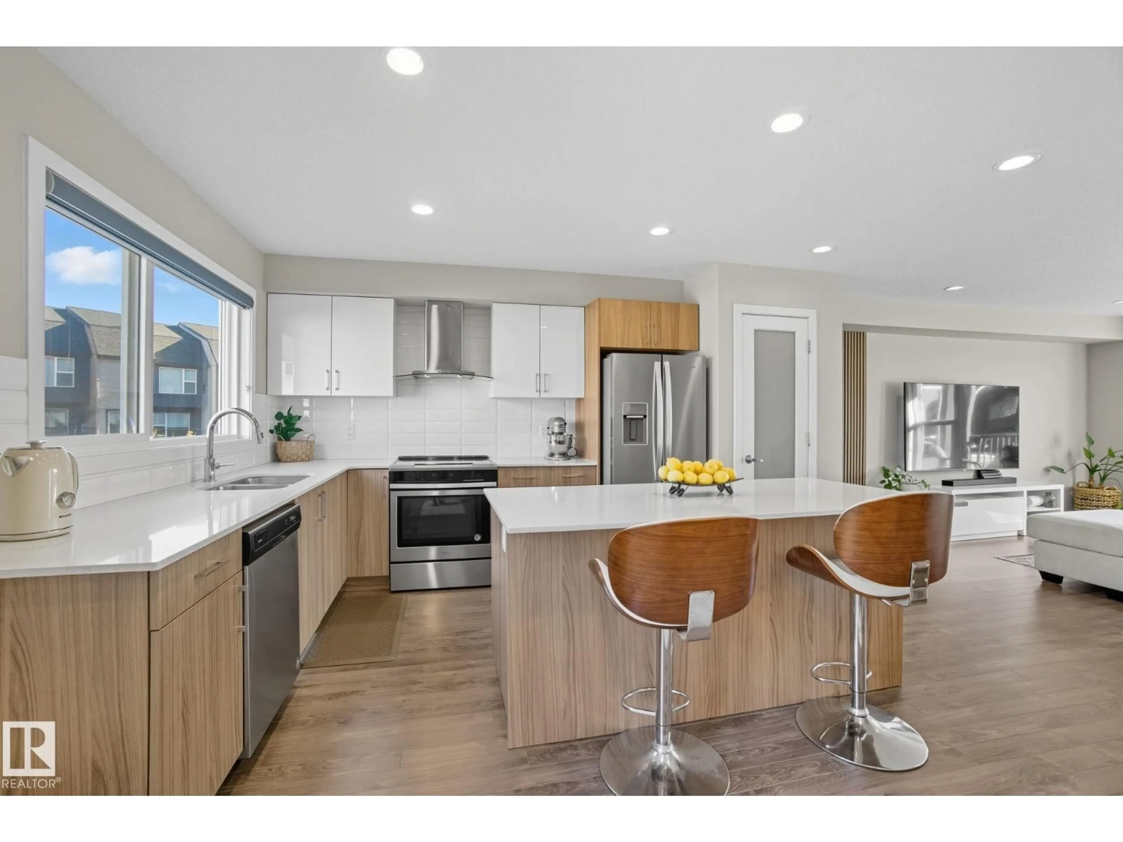 Open concept kitchen, wood/laminate floor for 29 1075 ROSENTHAL BV, Edmonton Alberta T5T7G5