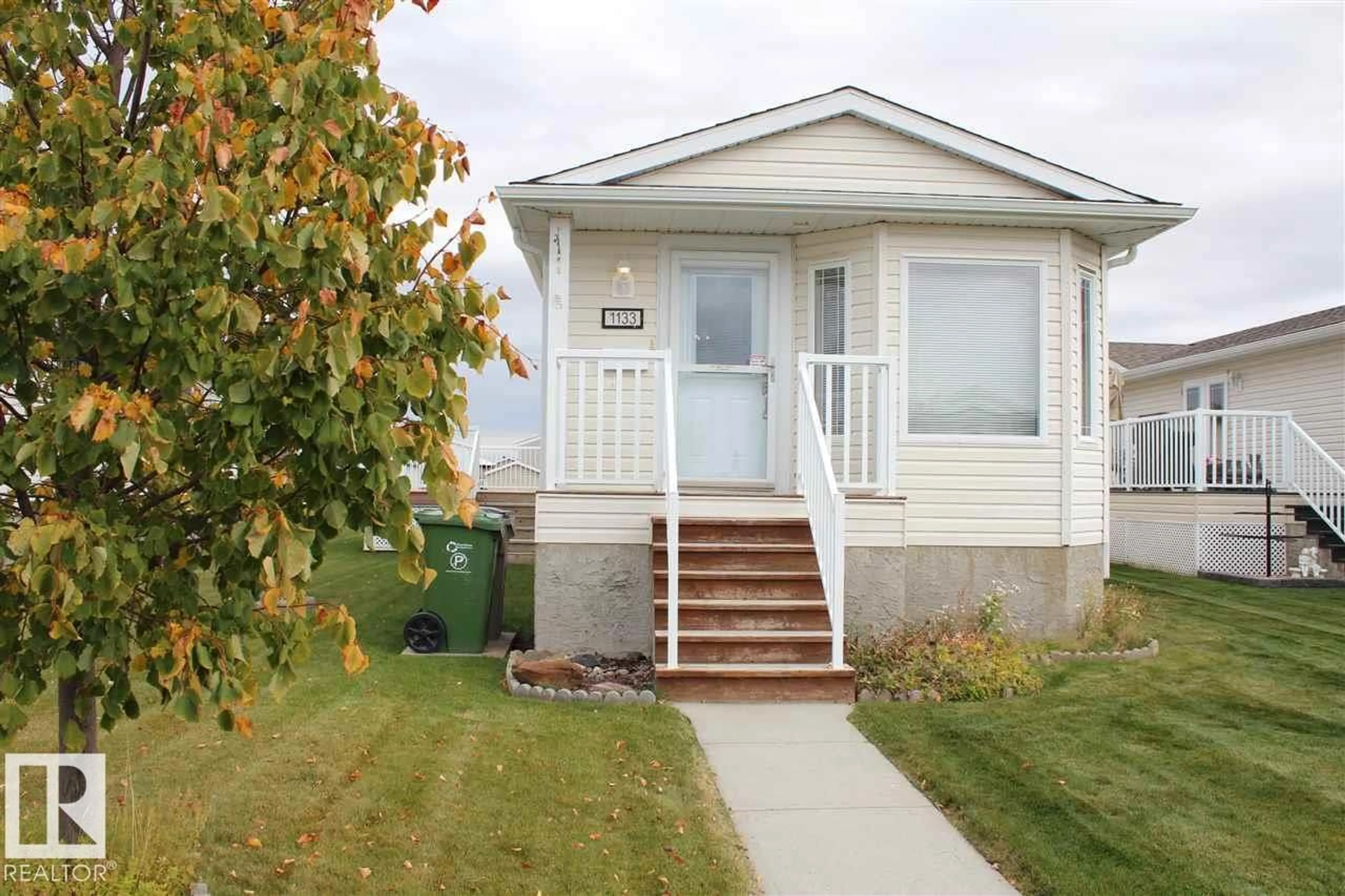 Home with vinyl exterior material, street for 1133 ASPEN DR, Leduc Alberta T9E8R2