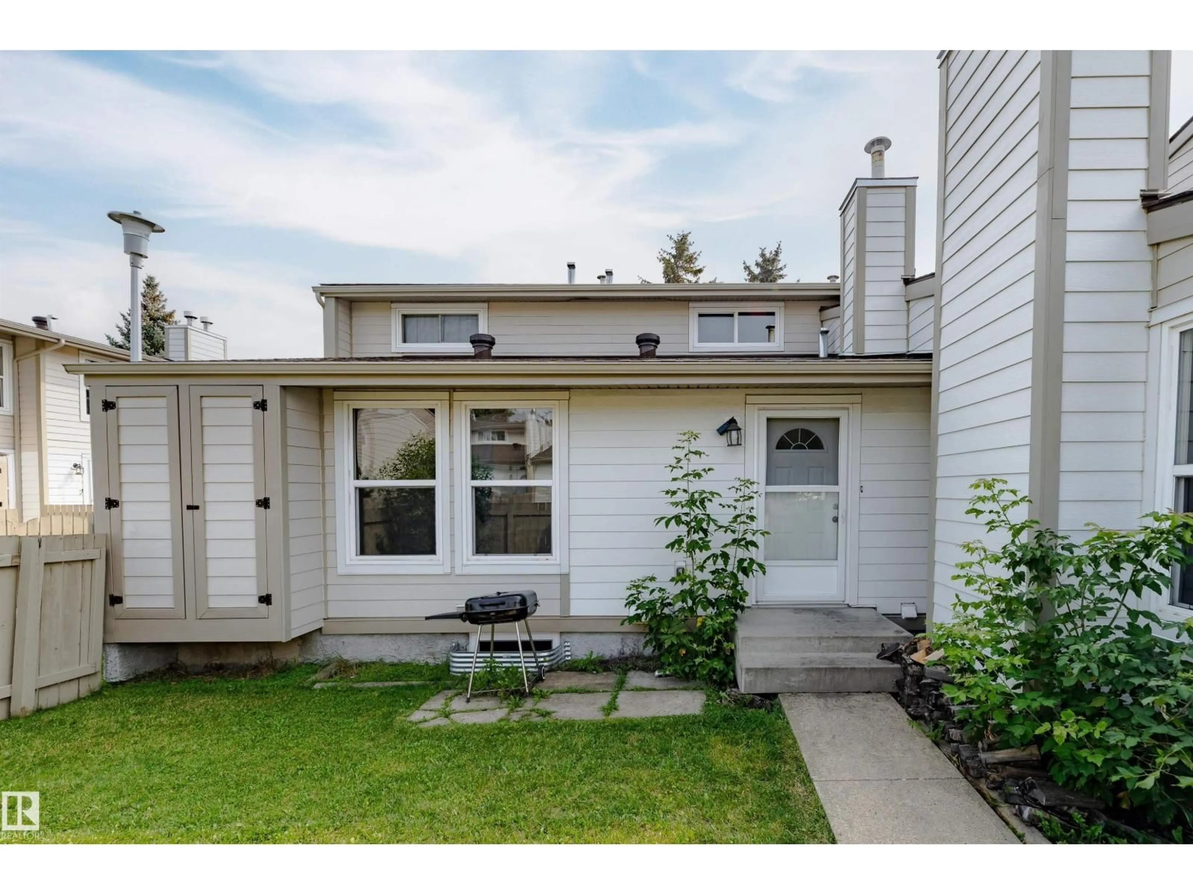 Home with vinyl exterior material, street for 1130 KNOTTWOOD RD, Edmonton Alberta T6K2J8
