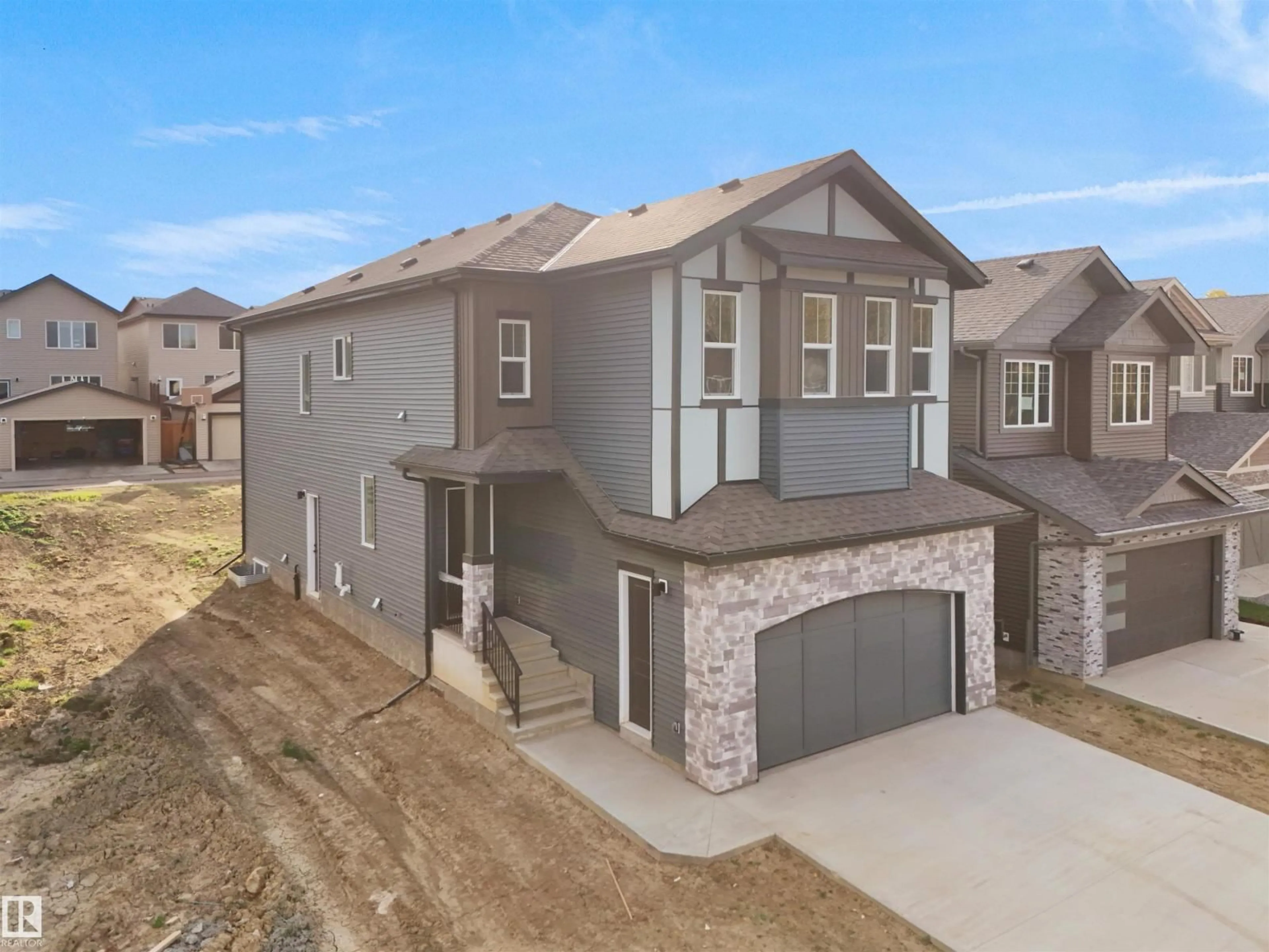 A pic from outside/outdoor area/front of a property/back of a property/a pic from drone, street for 1113 GYRFALCON CR, Edmonton Alberta T5S0S5