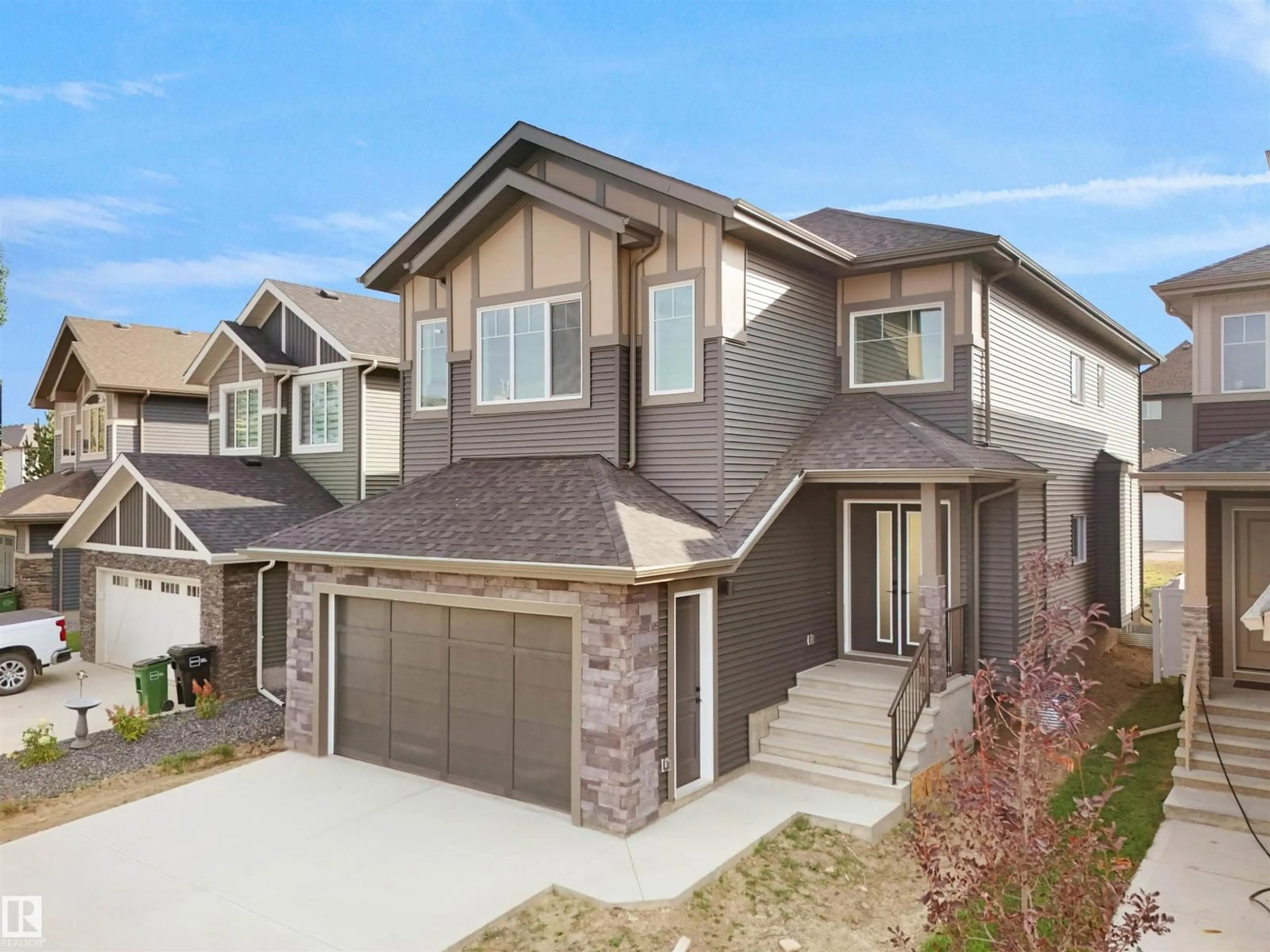 Home with vinyl exterior material, street for 1107 GYRFALCON CR, Edmonton Alberta T5S0S5