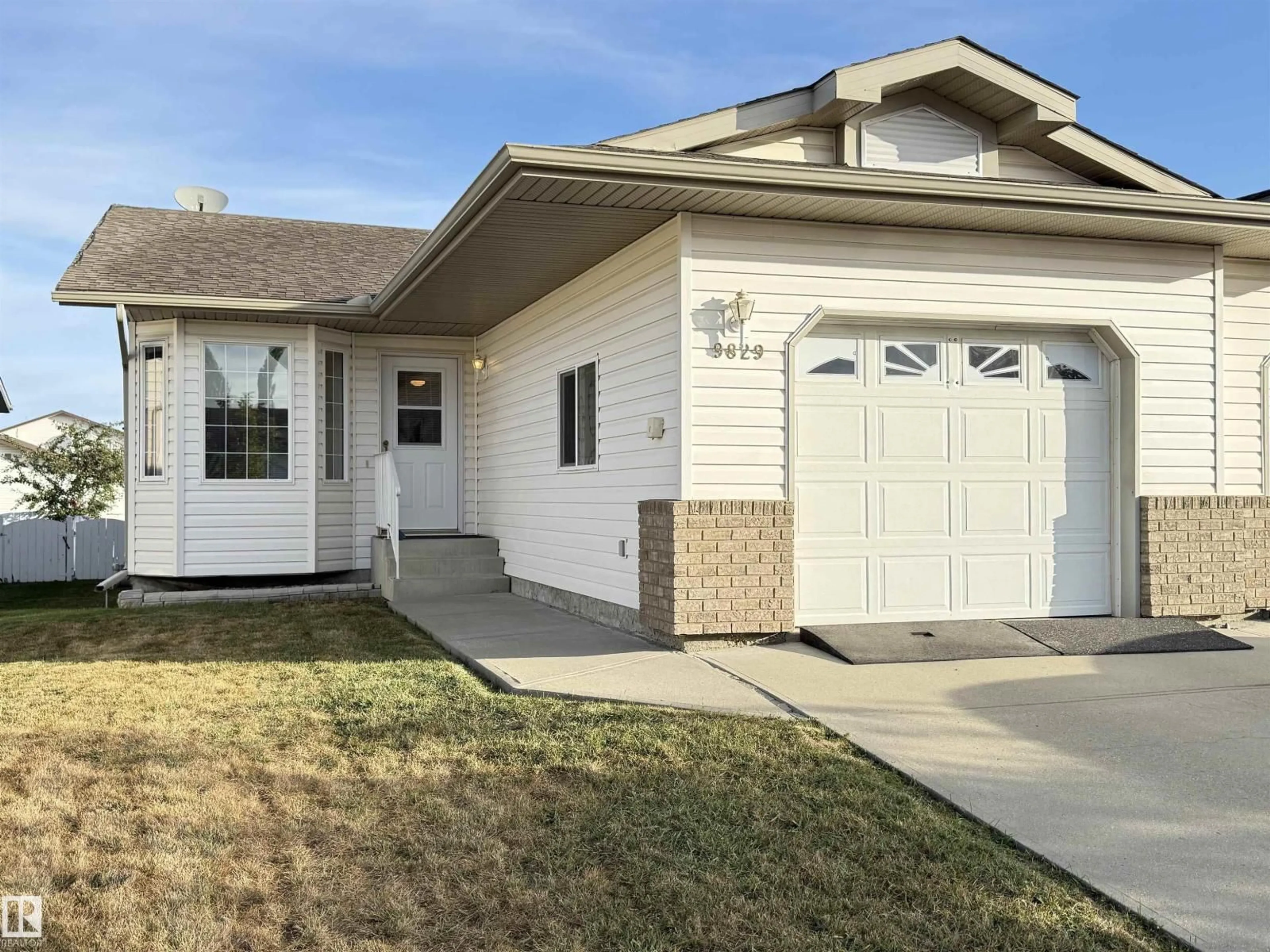 Home with vinyl exterior material, street for 9829 100 A, Morinville Alberta T8R1T1