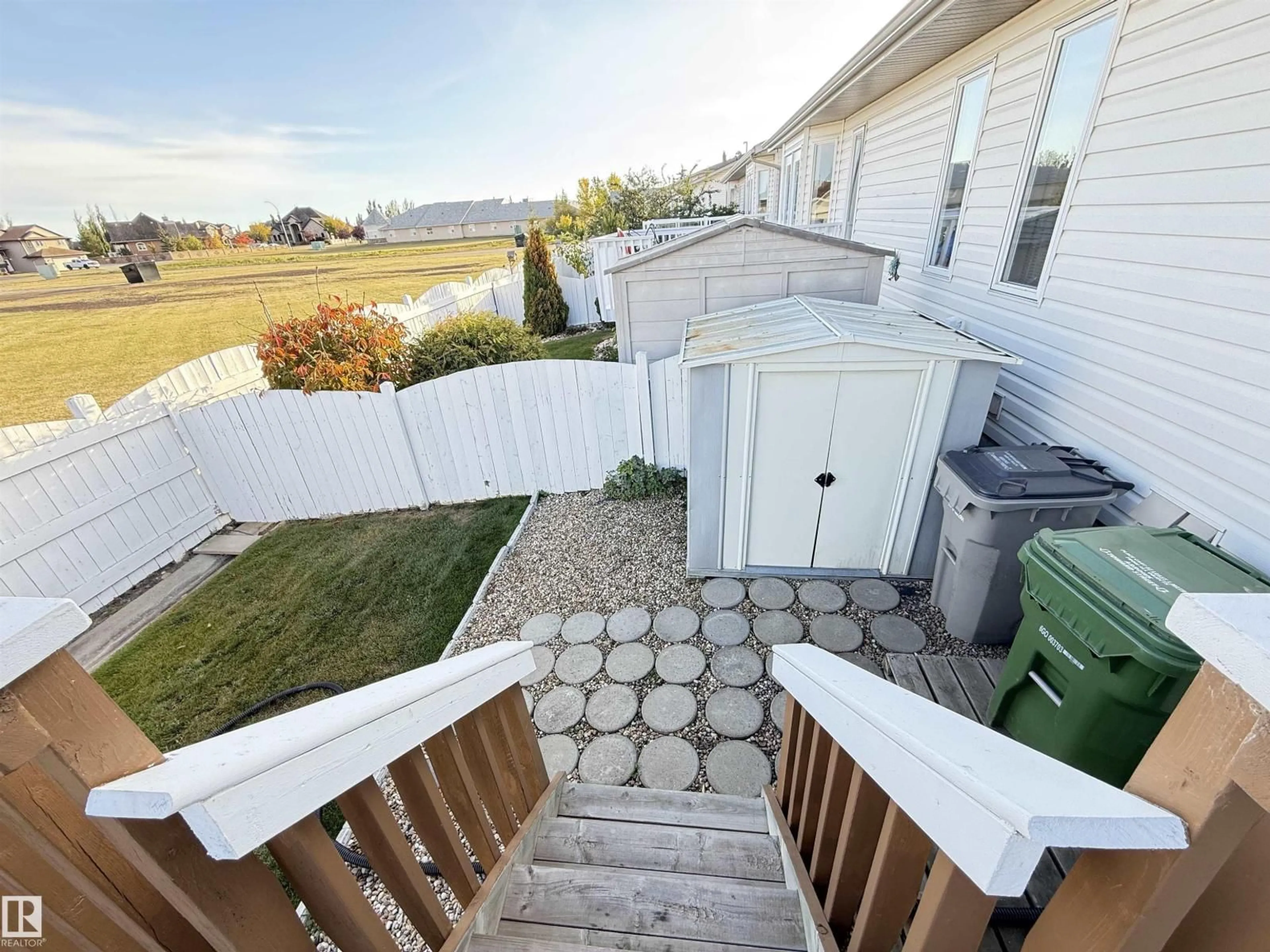 A pic from outside/outdoor area/front of a property/back of a property/a pic from drone, water/lake/river/ocean view for 9829 100 A, Morinville Alberta T8R1T1