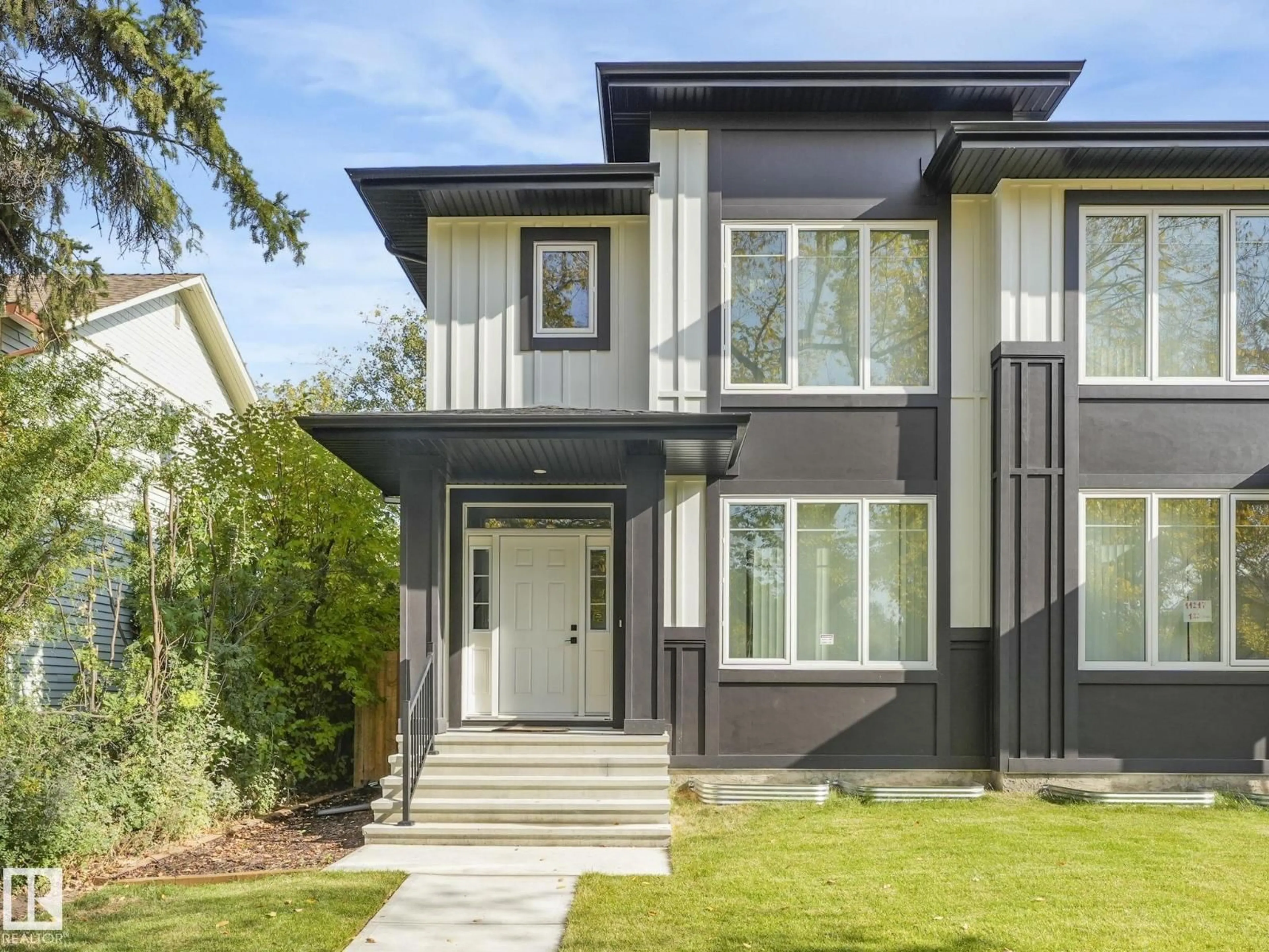 Home with vinyl exterior material, street for 11219 125 ST, Edmonton Alberta T5M0M6