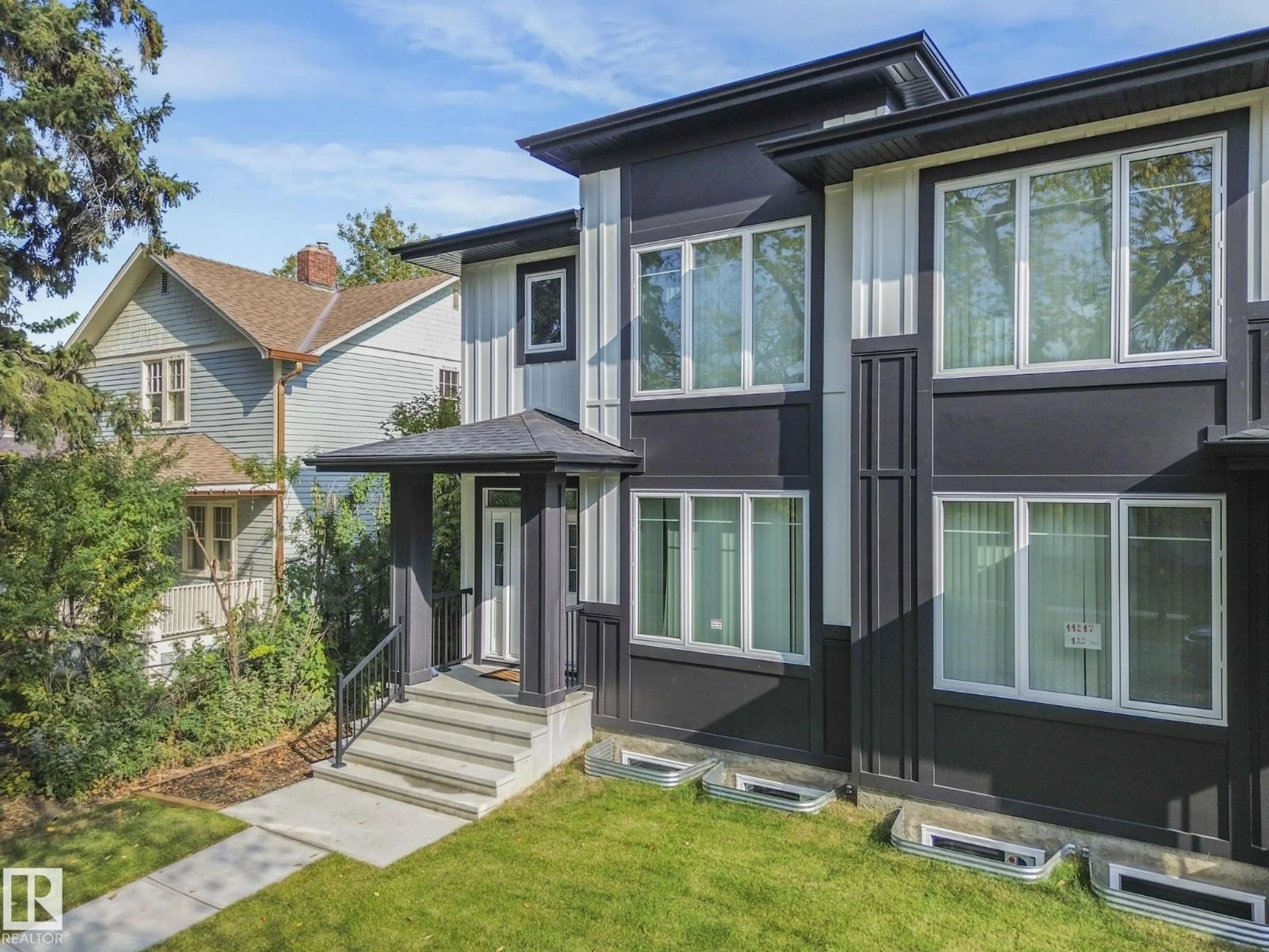 Home with vinyl exterior material, street for 11219 125 ST, Edmonton Alberta T5M0M6