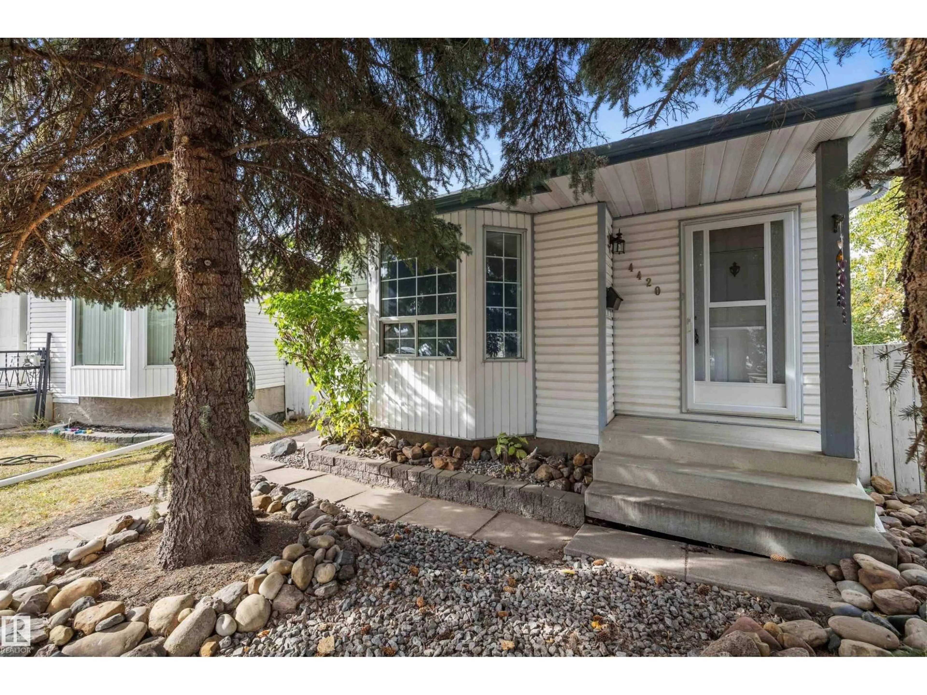 Home with vinyl exterior material, street for 4420 36A ST, Edmonton Alberta T6L6K5