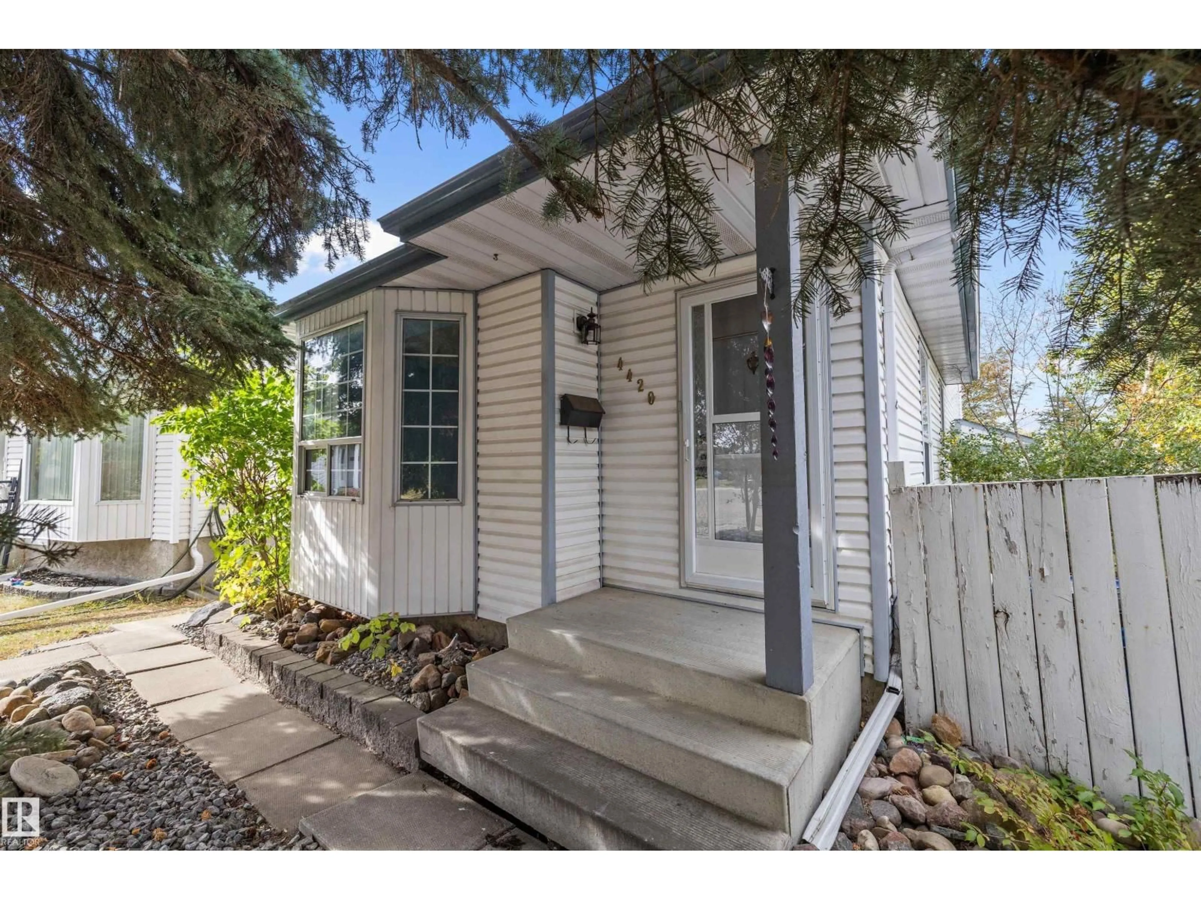 Home with vinyl exterior material, street for 4420 36A ST, Edmonton Alberta T6L6K5