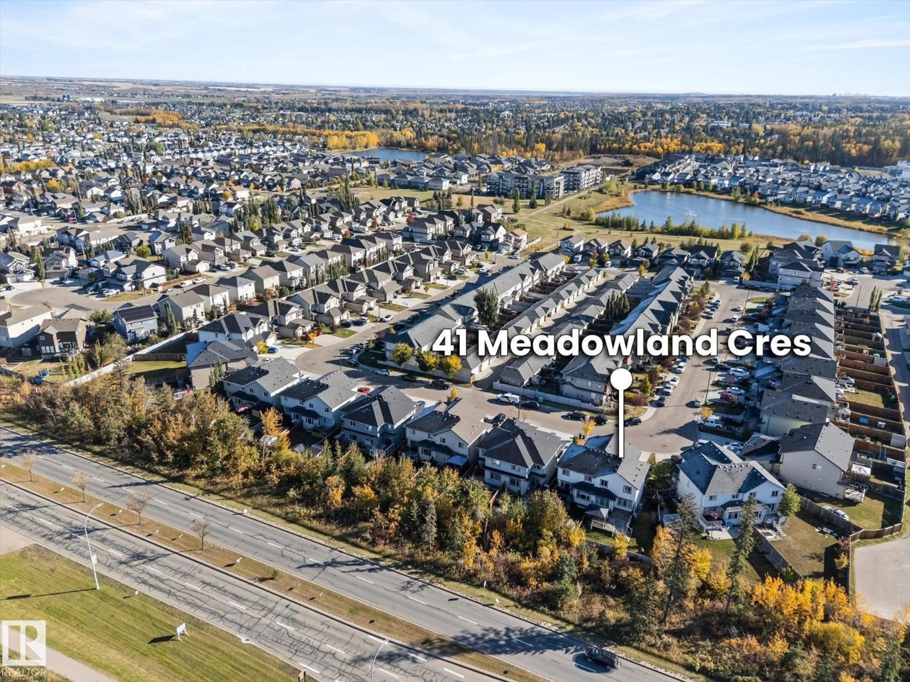 A pic from outside/outdoor area/front of a property/back of a property/a pic from drone, mountain view for 41 MEADOWLAND CR, Spruce Grove Alberta T7X0P9