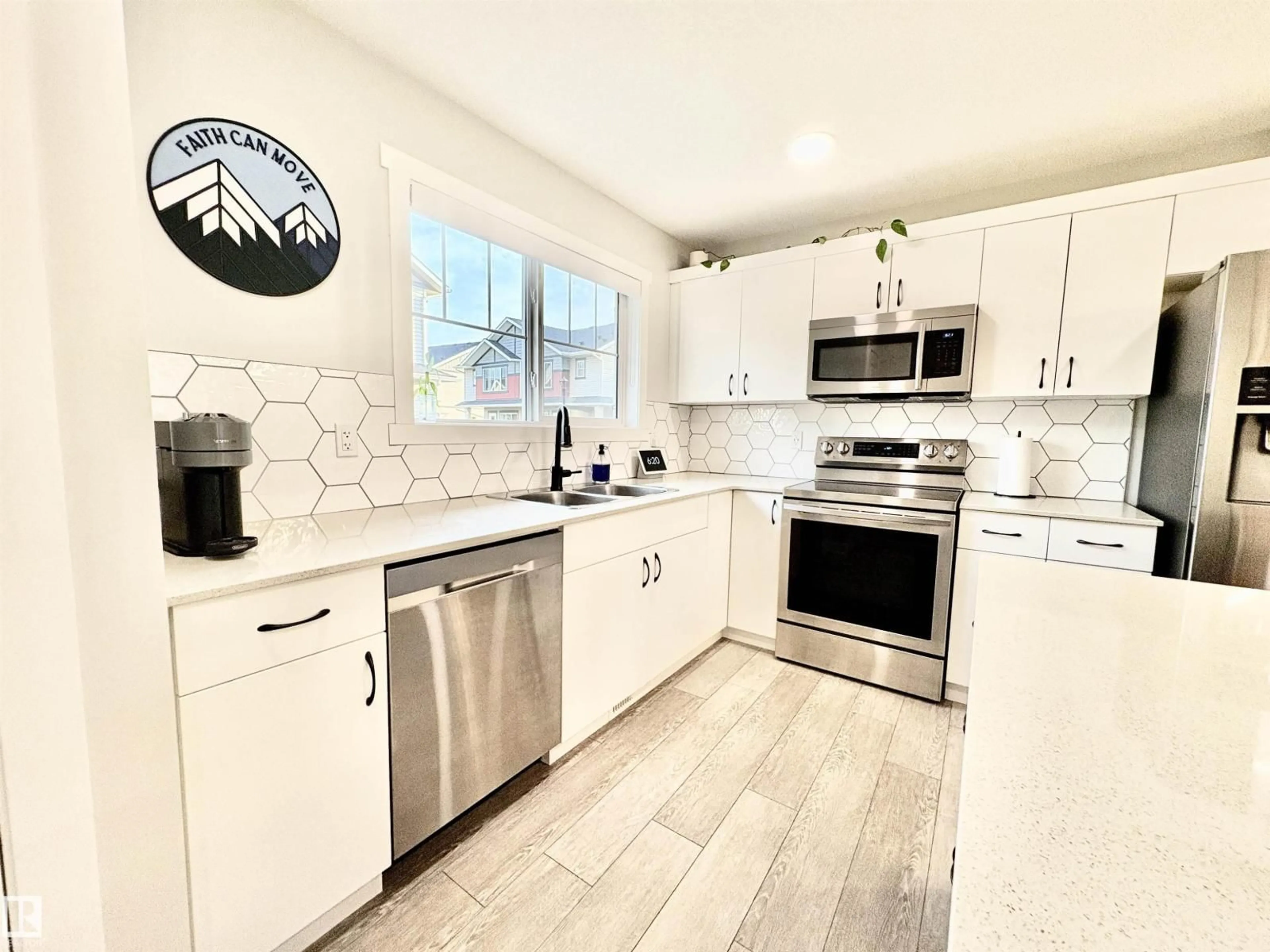 Open concept kitchen, ceramic/tile floor for 16 165 CY BECKER BV, Edmonton Alberta T5Y3R4