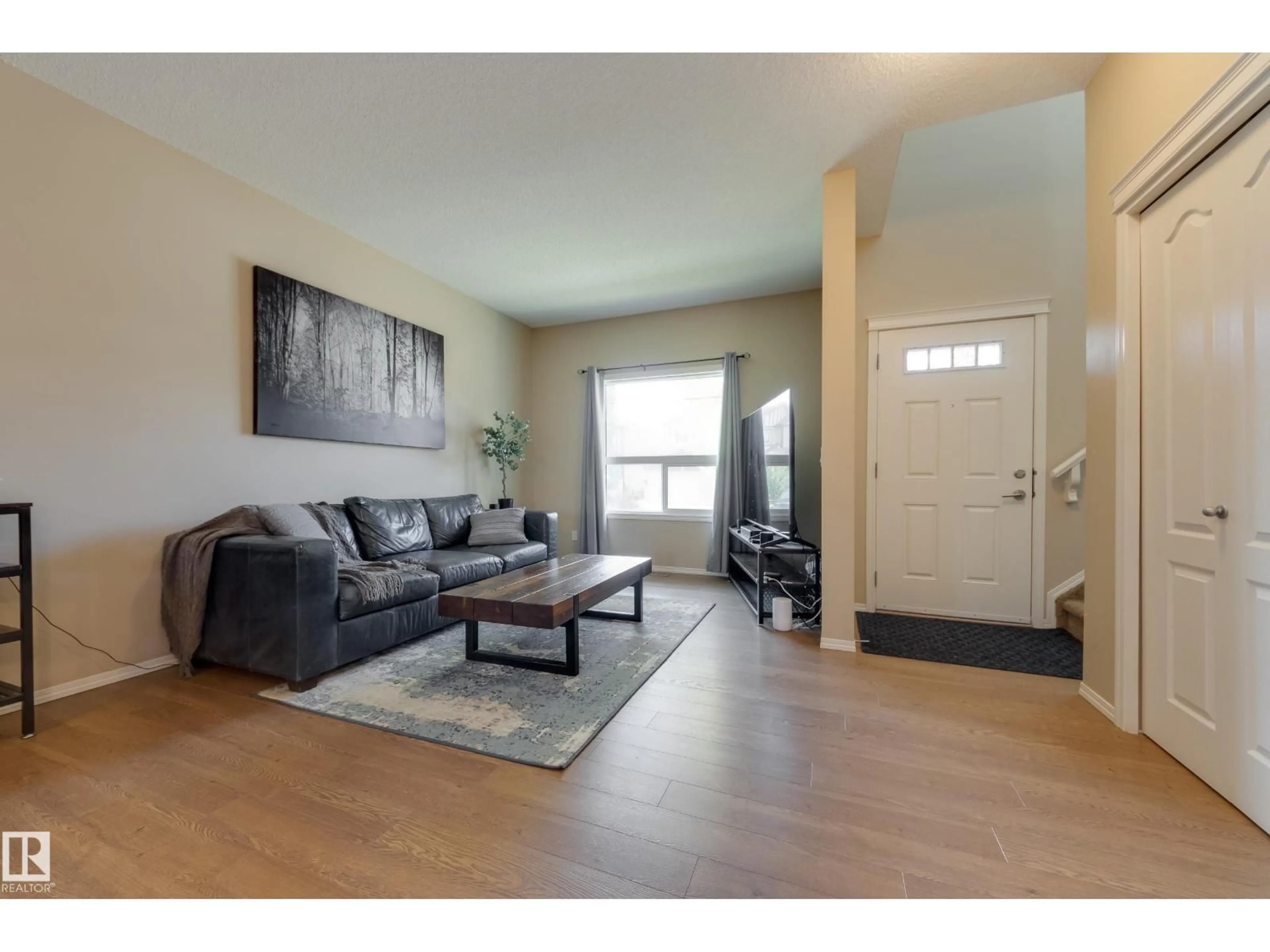 Living room with furniture, wood/laminate floor for 97 SANTANA CRESCENT, Fort Saskatchewan Alberta T8L0N8