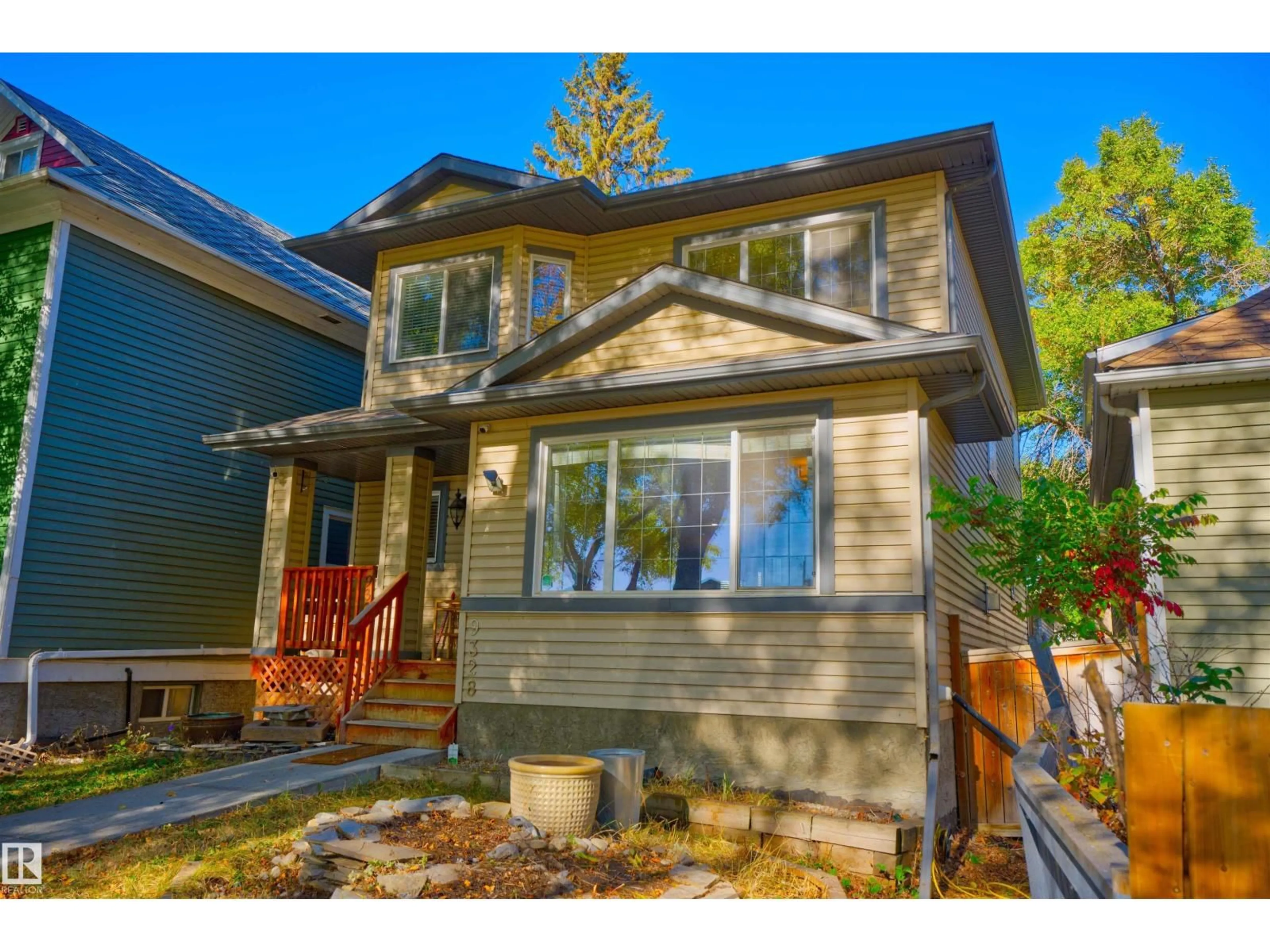 Home with vinyl exterior material, street for 9328 107 AV, Edmonton Alberta T5H0T5