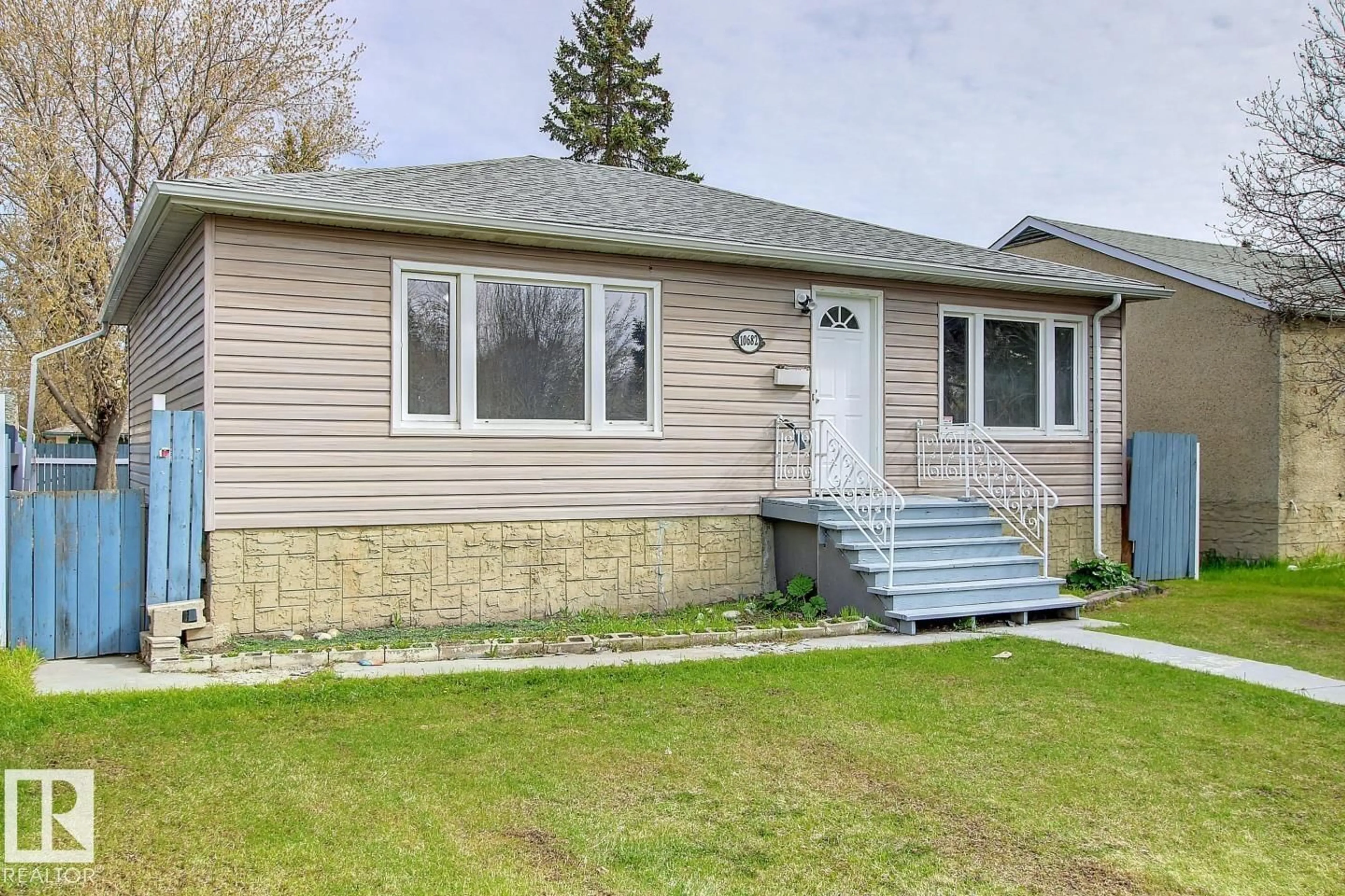 Home with vinyl exterior material, street for 10682 61 AV, Edmonton Alberta T6H1L7