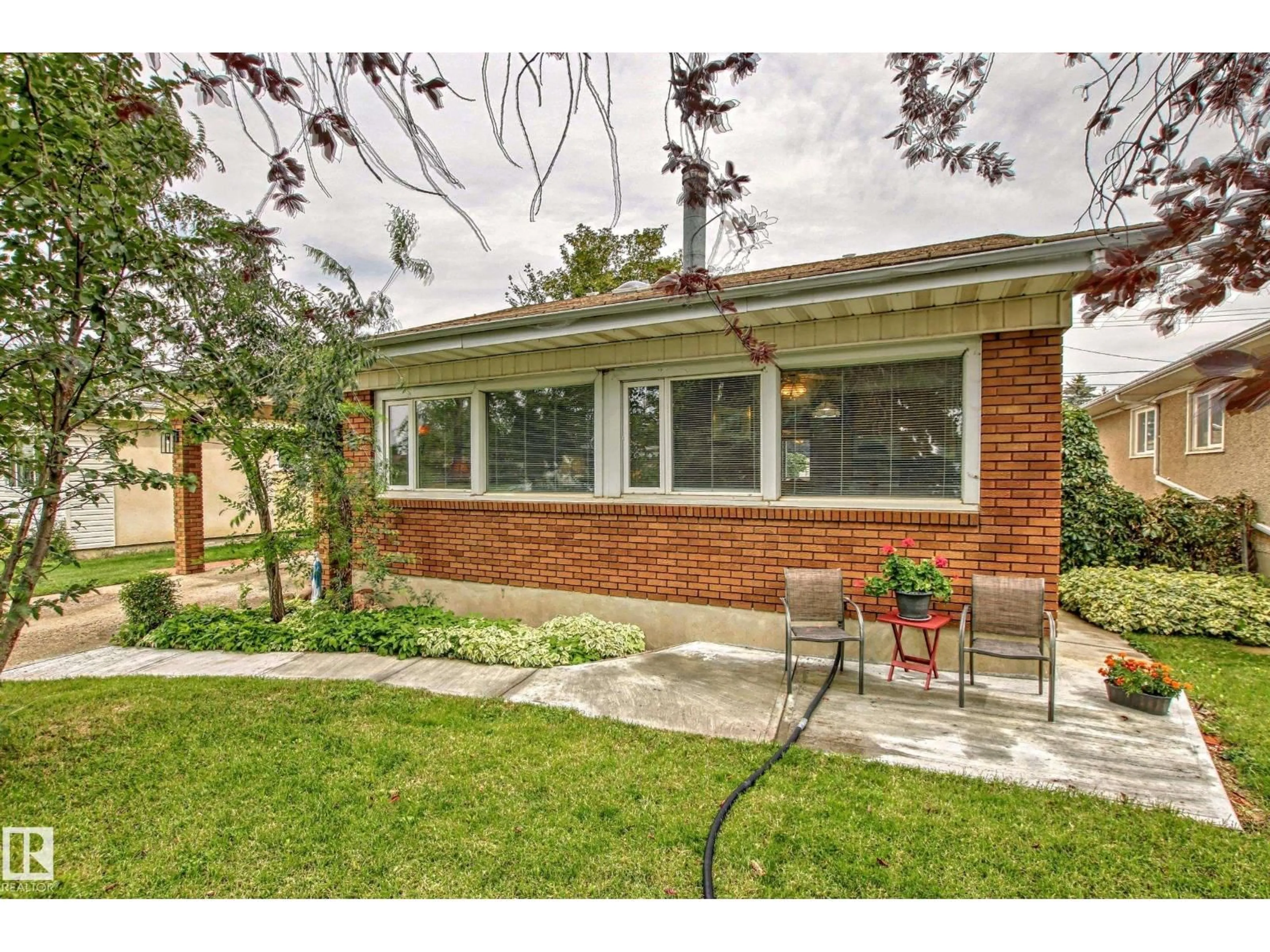 Home with brick exterior material, street for 8507 56 ST, Edmonton Alberta T6B1H8