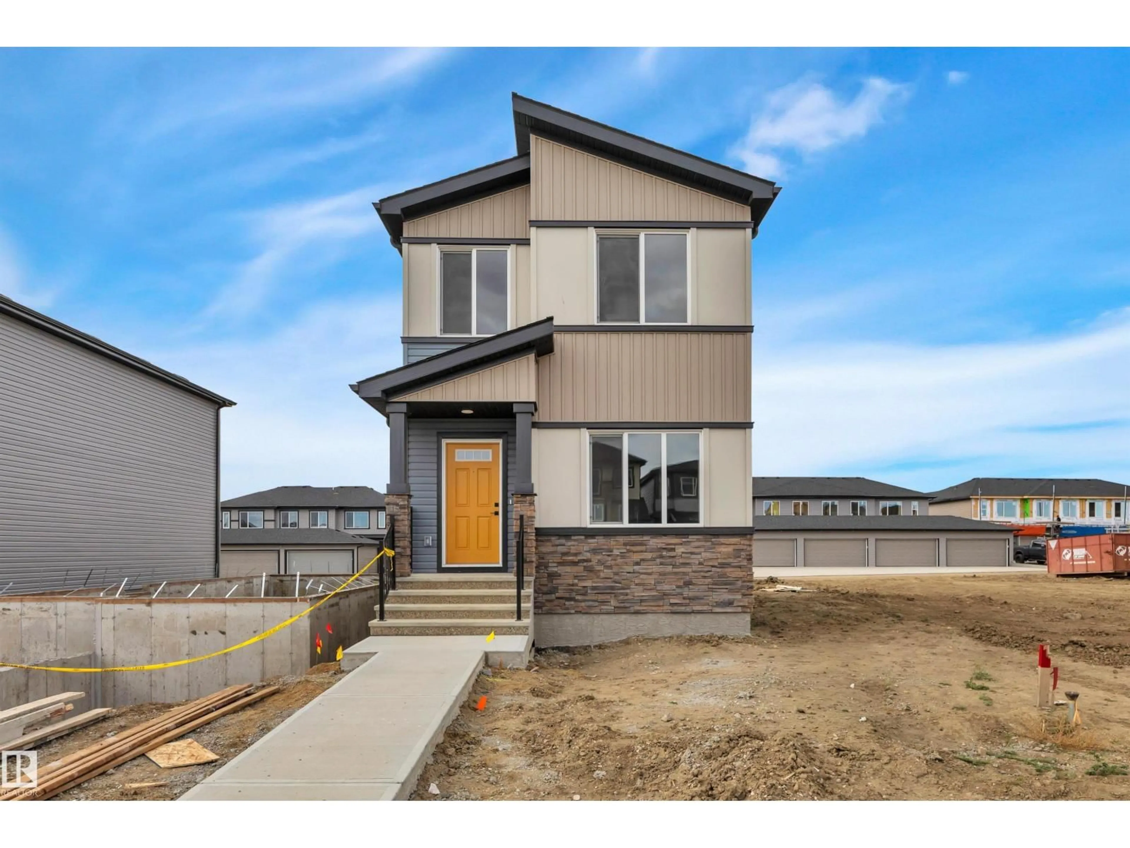 Home with brick exterior material, street for 207 WATTLE RD, Leduc Alberta T9E1L3
