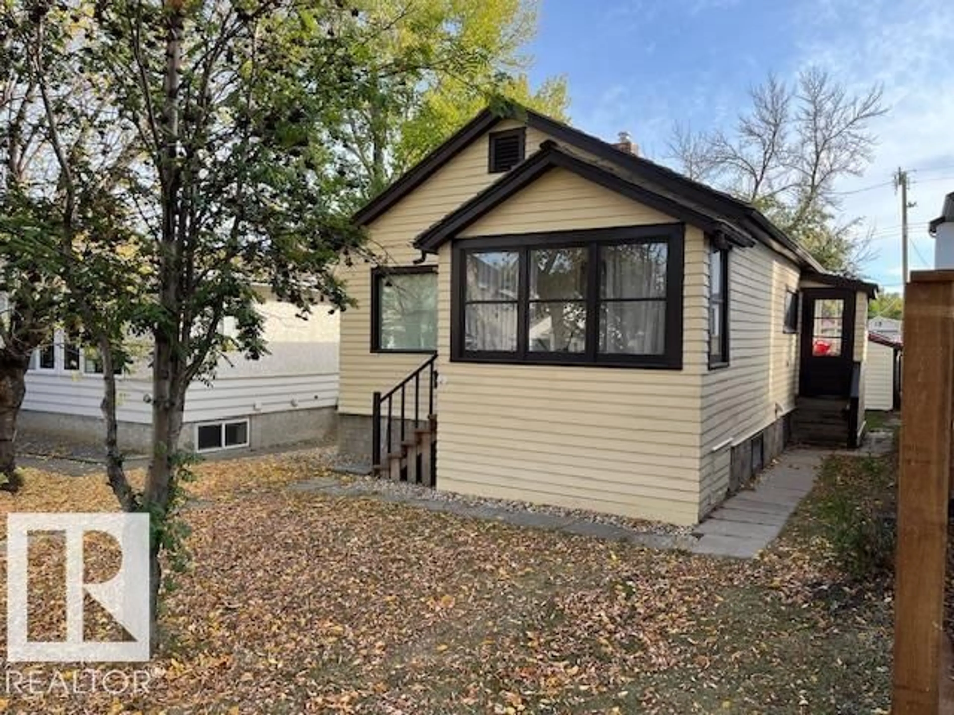 Home with vinyl exterior material, street for 11419 79 AV, Edmonton Alberta T6G0P5