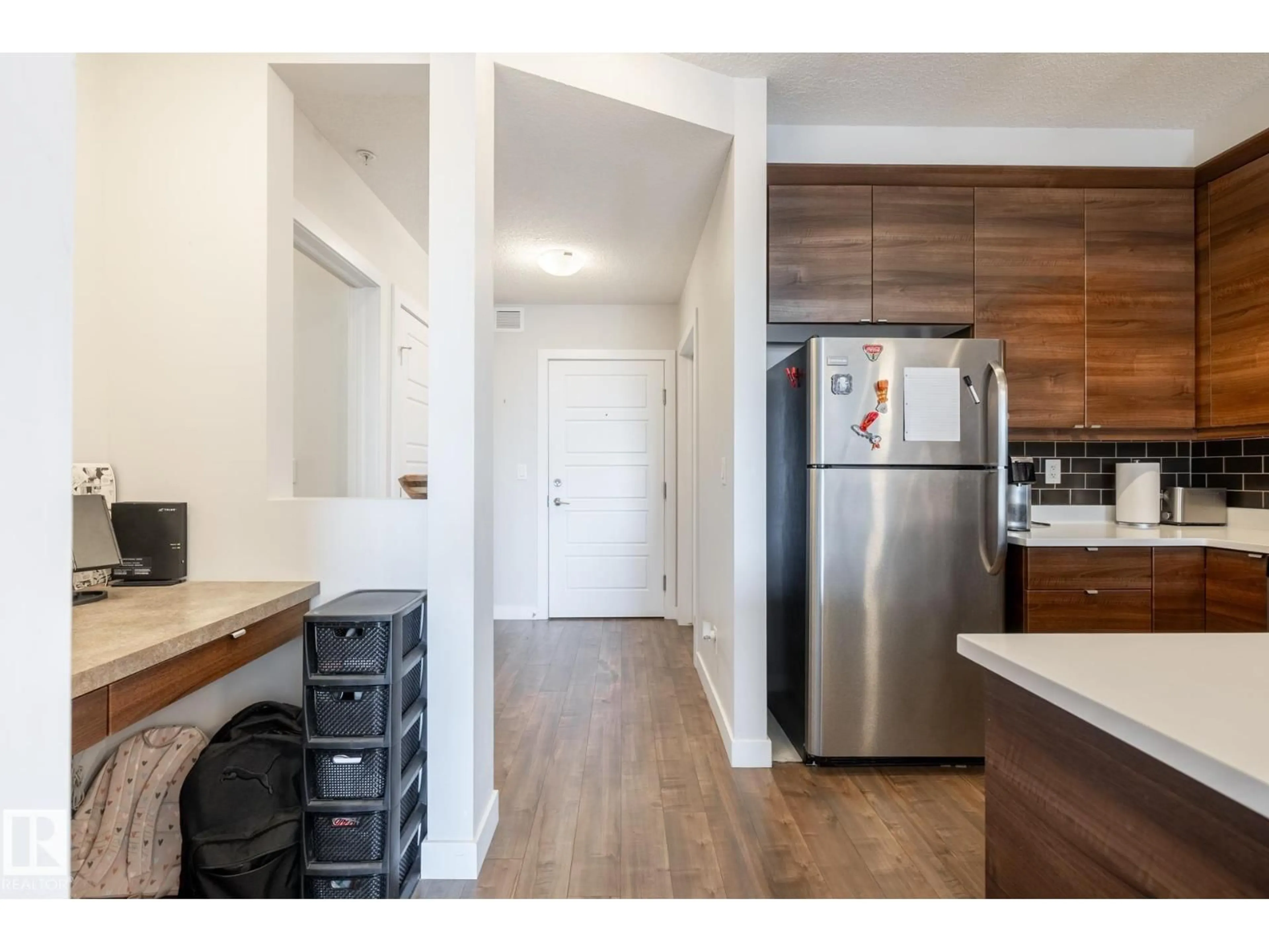 Open concept kitchen, wood/laminate floor for #202 - 2590 ANDERSON WY, Edmonton Alberta T6W0R2