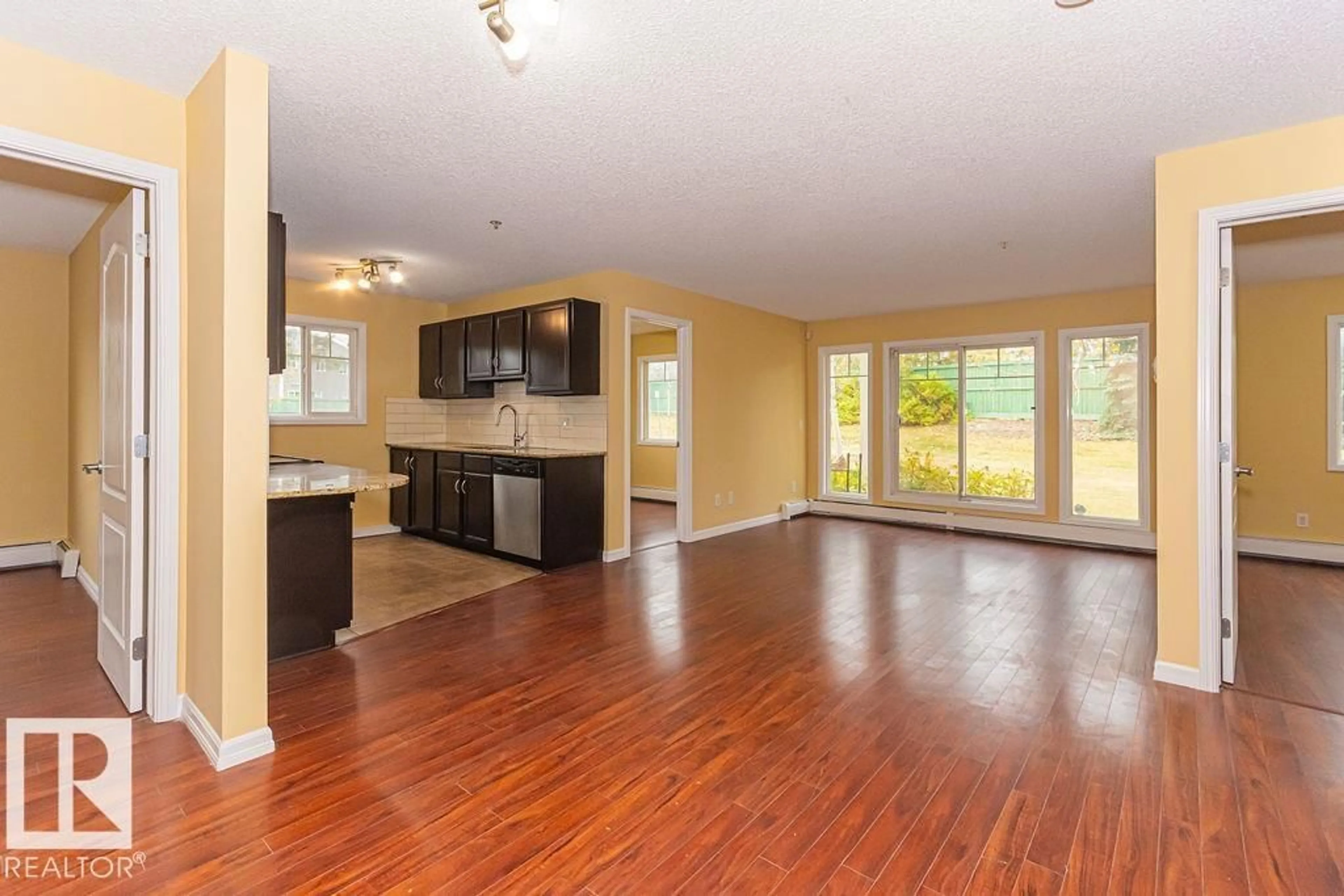 Open concept kitchen, wood/laminate floor for 105 - 271 CHARLOTTE WY, Sherwood Park Alberta T8H0N9