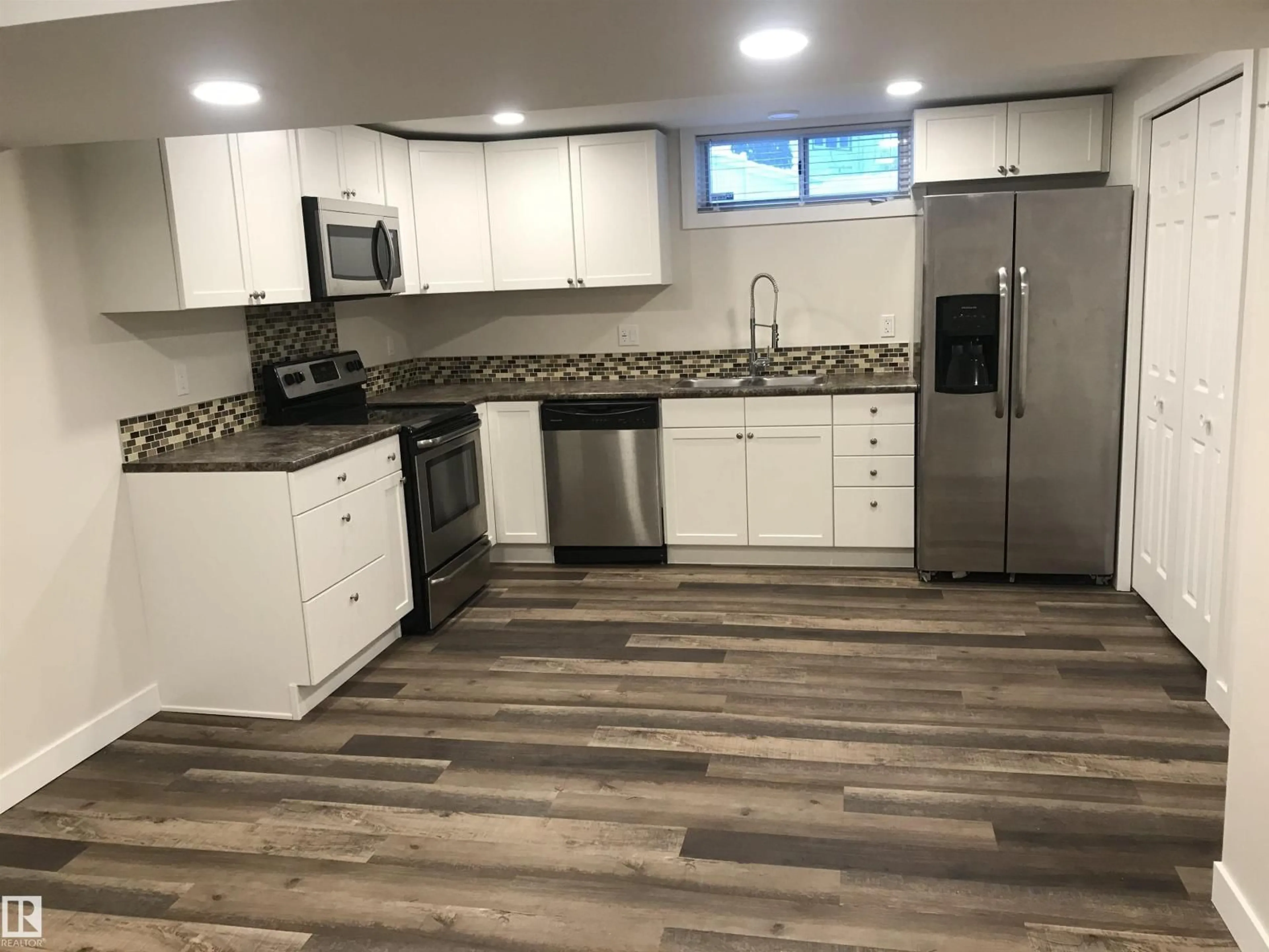 Open concept kitchen, unknown for 8032 70 AV, Edmonton Alberta T6C0A5