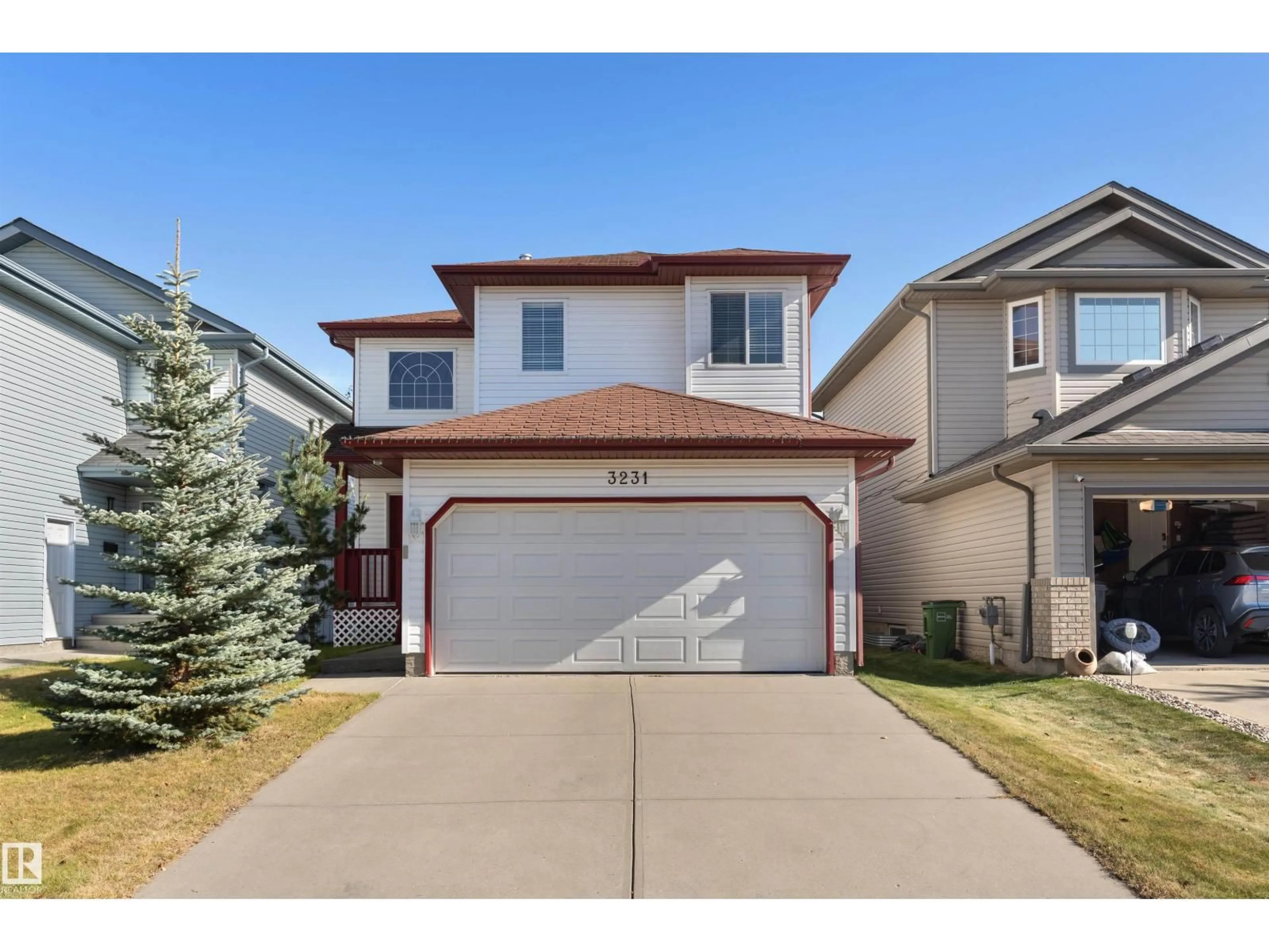 Home with vinyl exterior material, street for 3231 21 ST, Edmonton Alberta T6T0A9