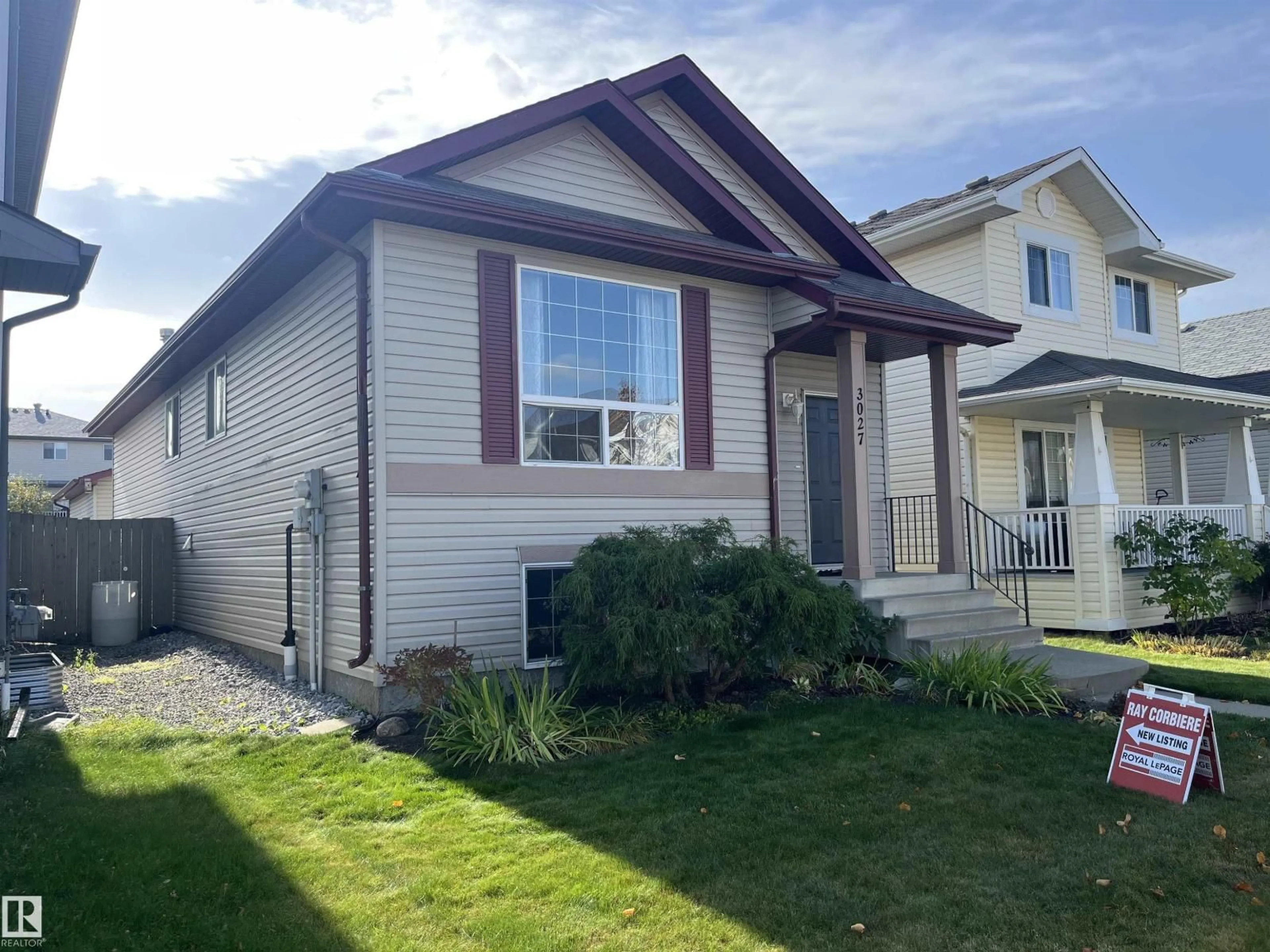 Home with vinyl exterior material, street for 3027 32 AV, Edmonton Alberta T6T1X1
