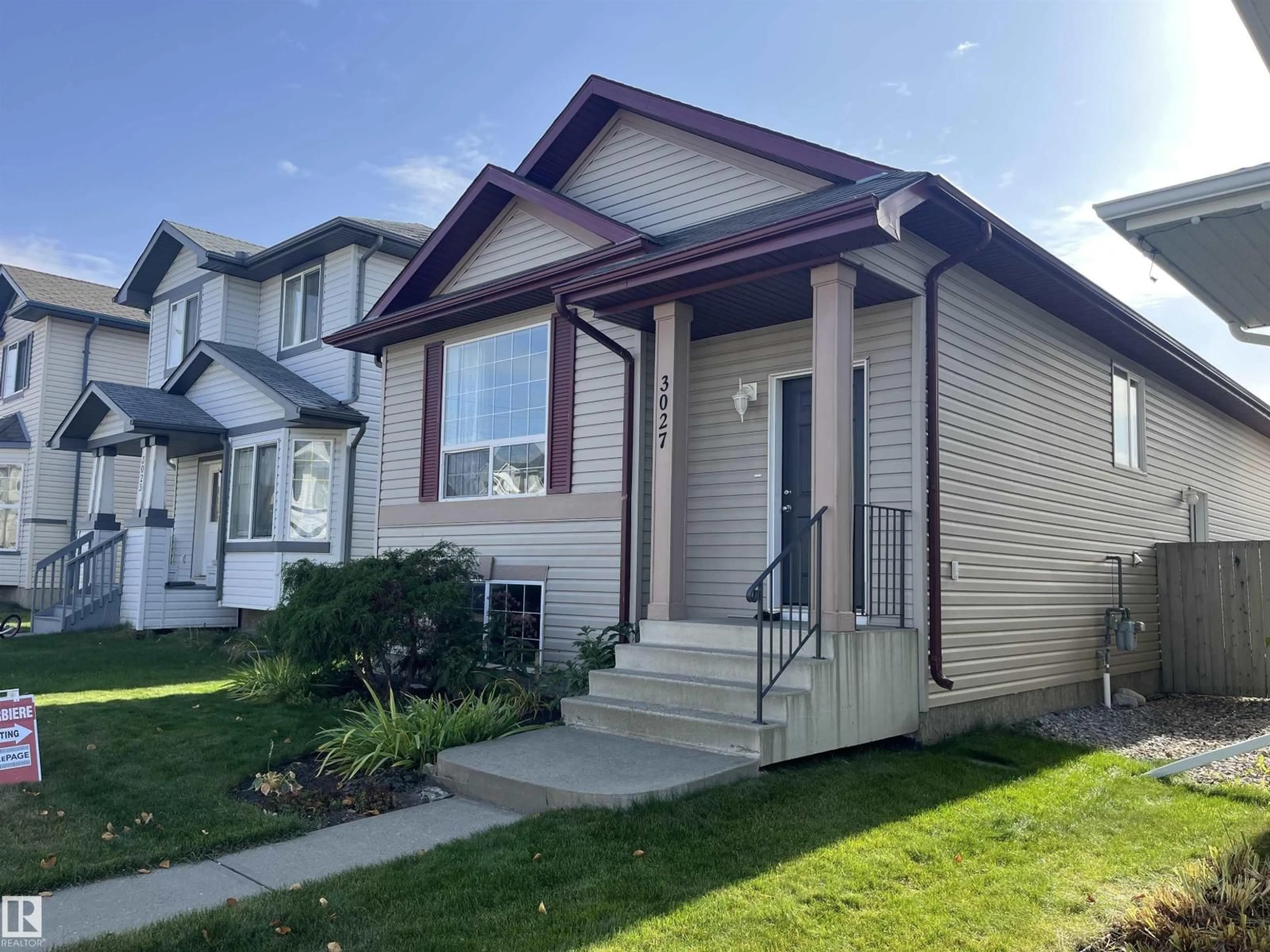 Home with vinyl exterior material, street for 3027 32 AV, Edmonton Alberta T6T1X1