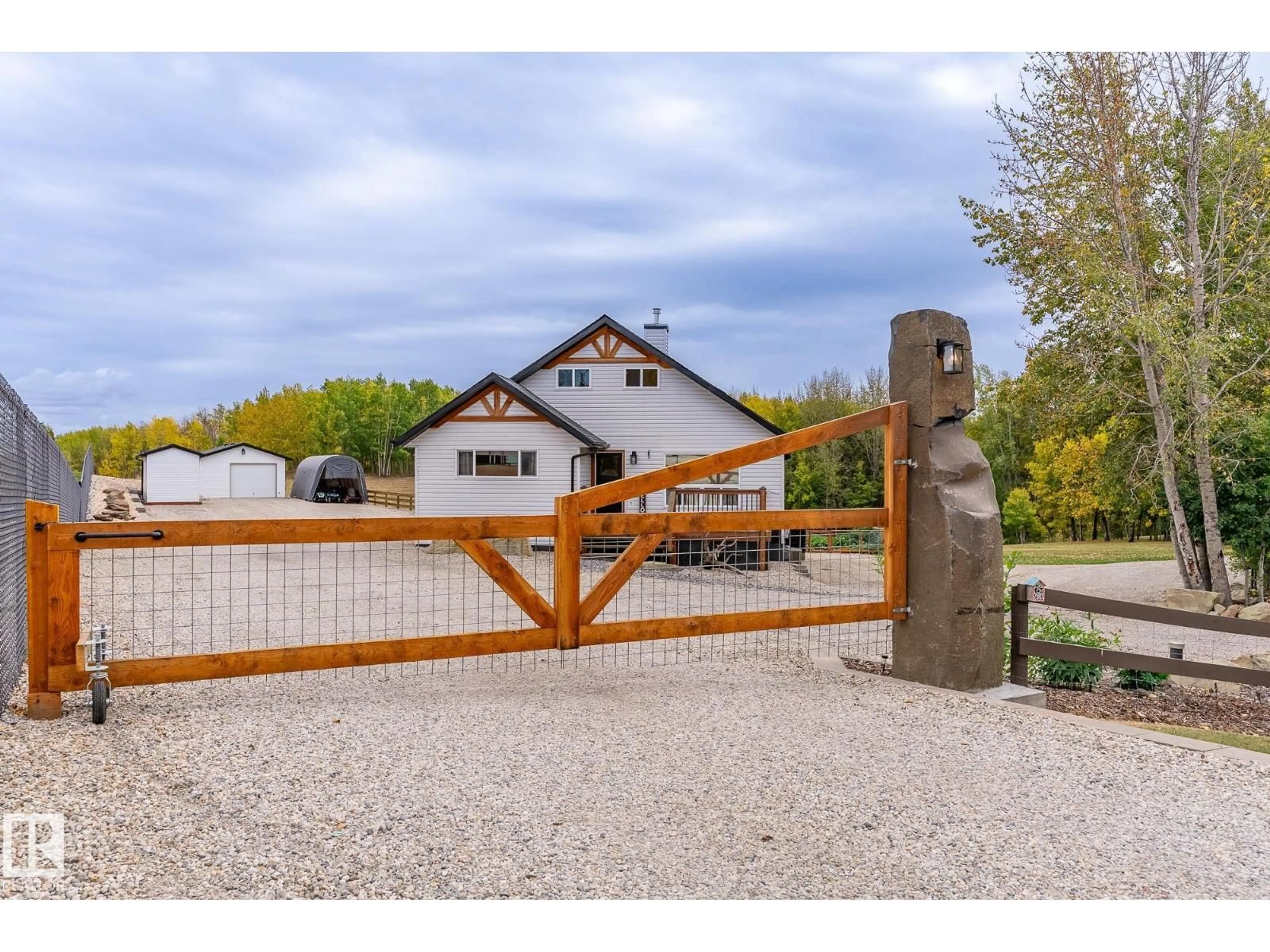 A pic from outside/outdoor area/front of a property/back of a property/a pic from drone, street for 105 52318 RGE ROAD 25, Rural Parkland County Alberta T7Y2M3