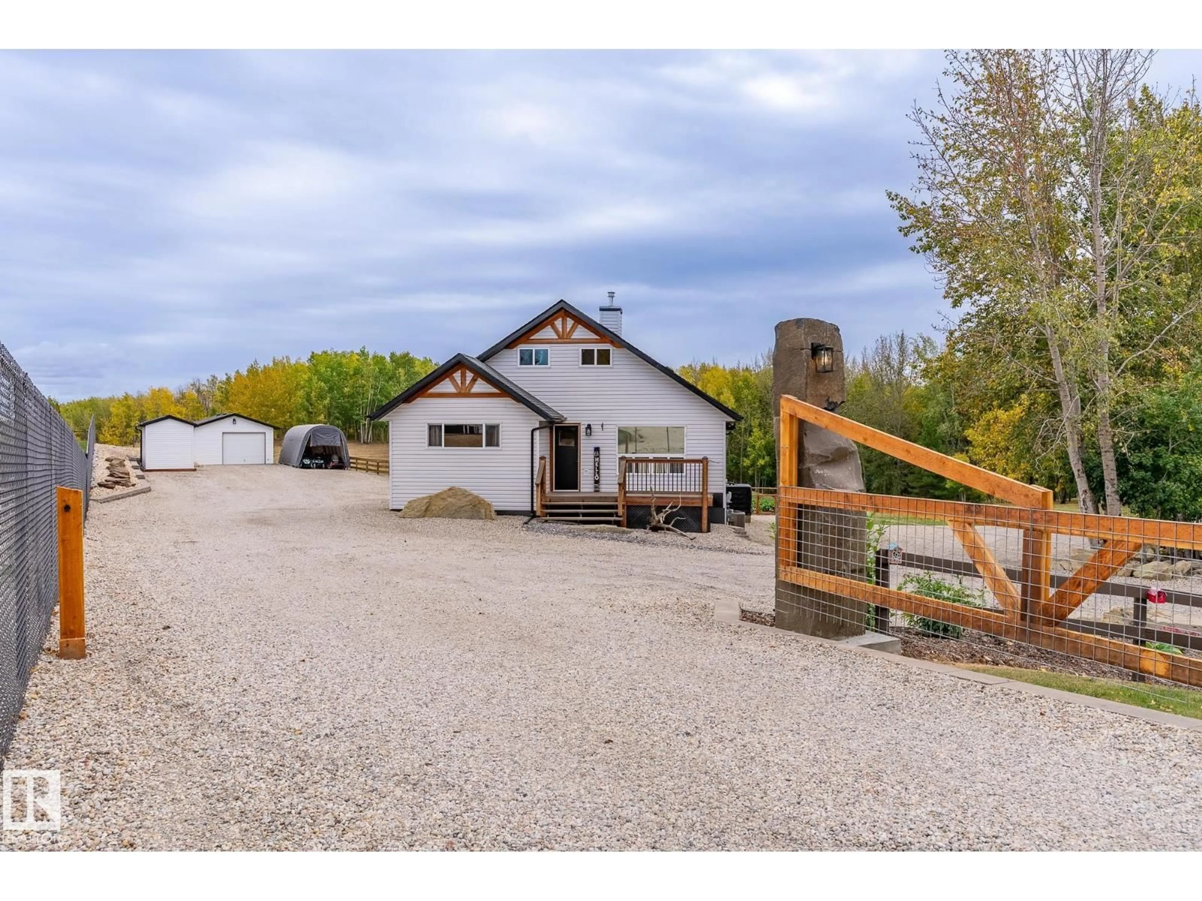 A pic from outside/outdoor area/front of a property/back of a property/a pic from drone, street for 105 52318 RGE ROAD 25, Rural Parkland County Alberta T7Y2M3