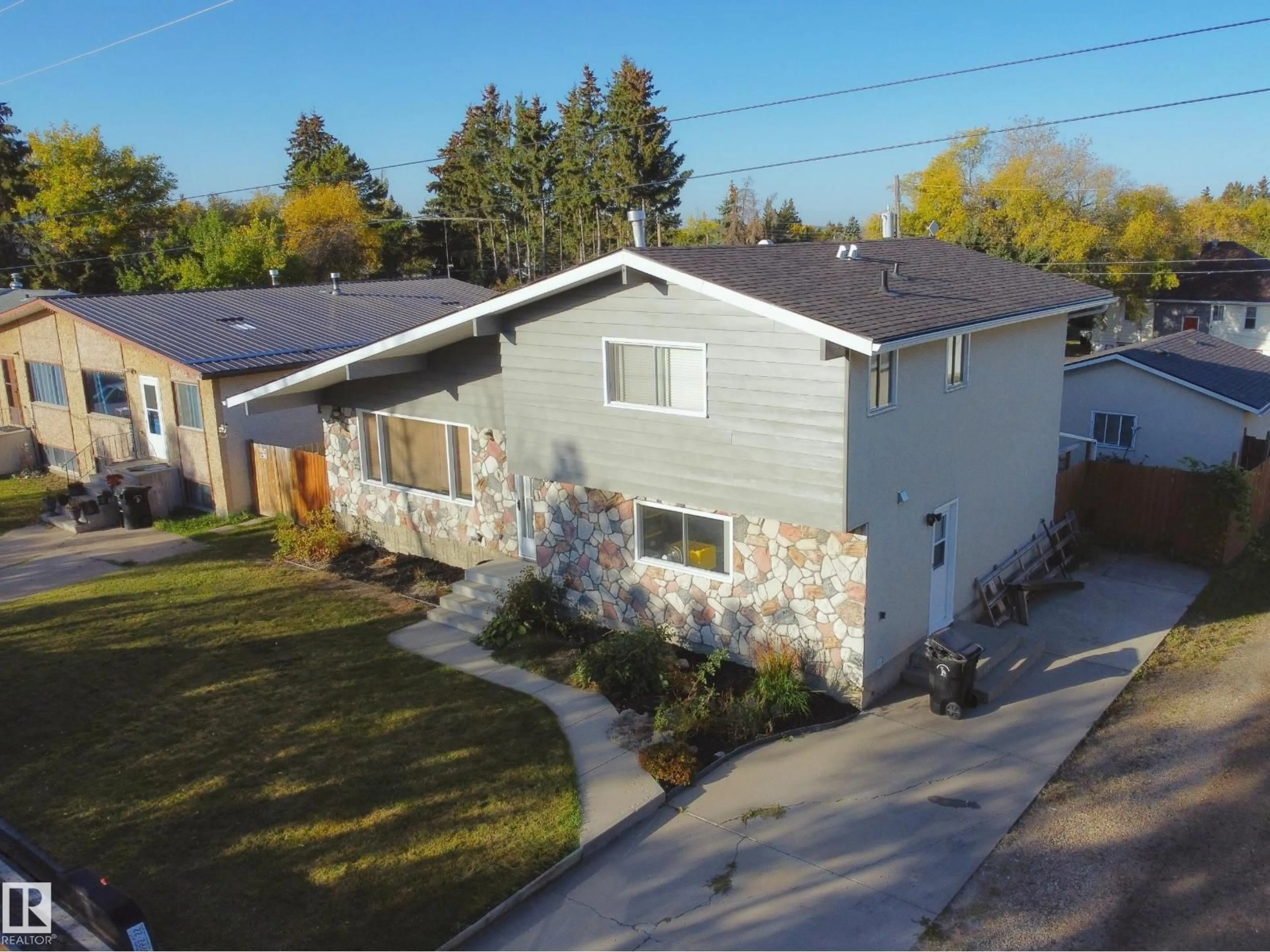 A pic from outside/outdoor area/front of a property/back of a property/a pic from drone, street for 5226 43 ST, Barrhead Alberta T7N1J7