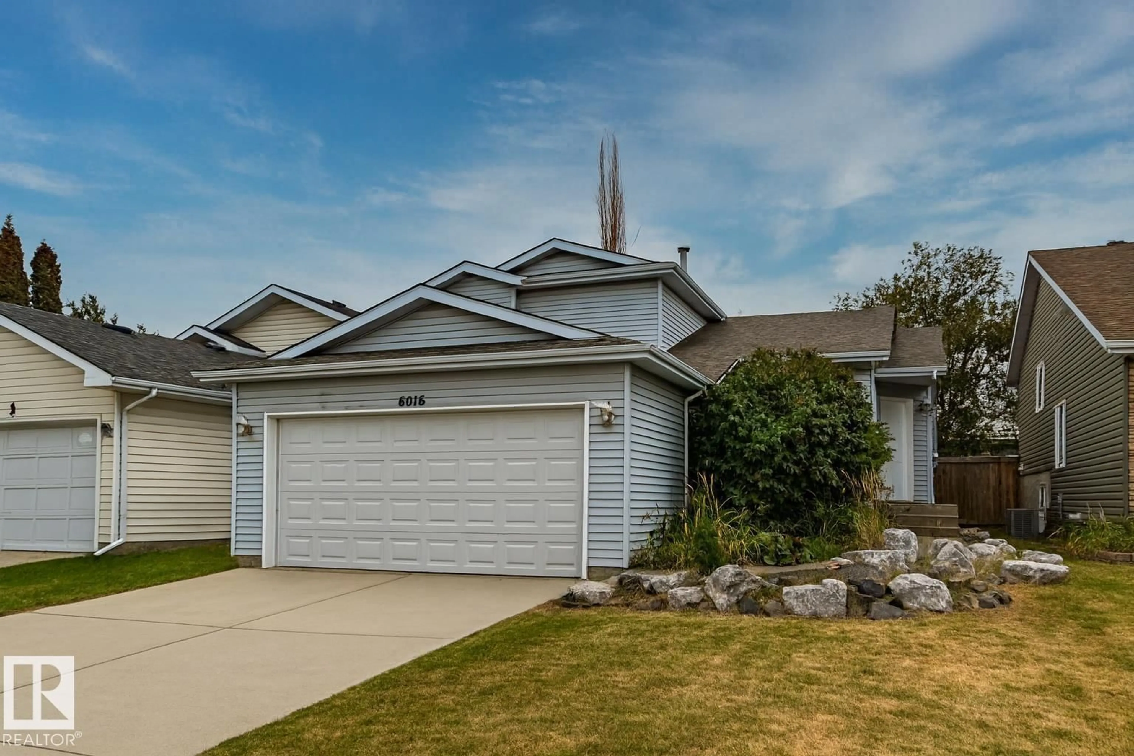 Home with vinyl exterior material, street for NW - 6016 189 ST, Edmonton Alberta T6M2G5