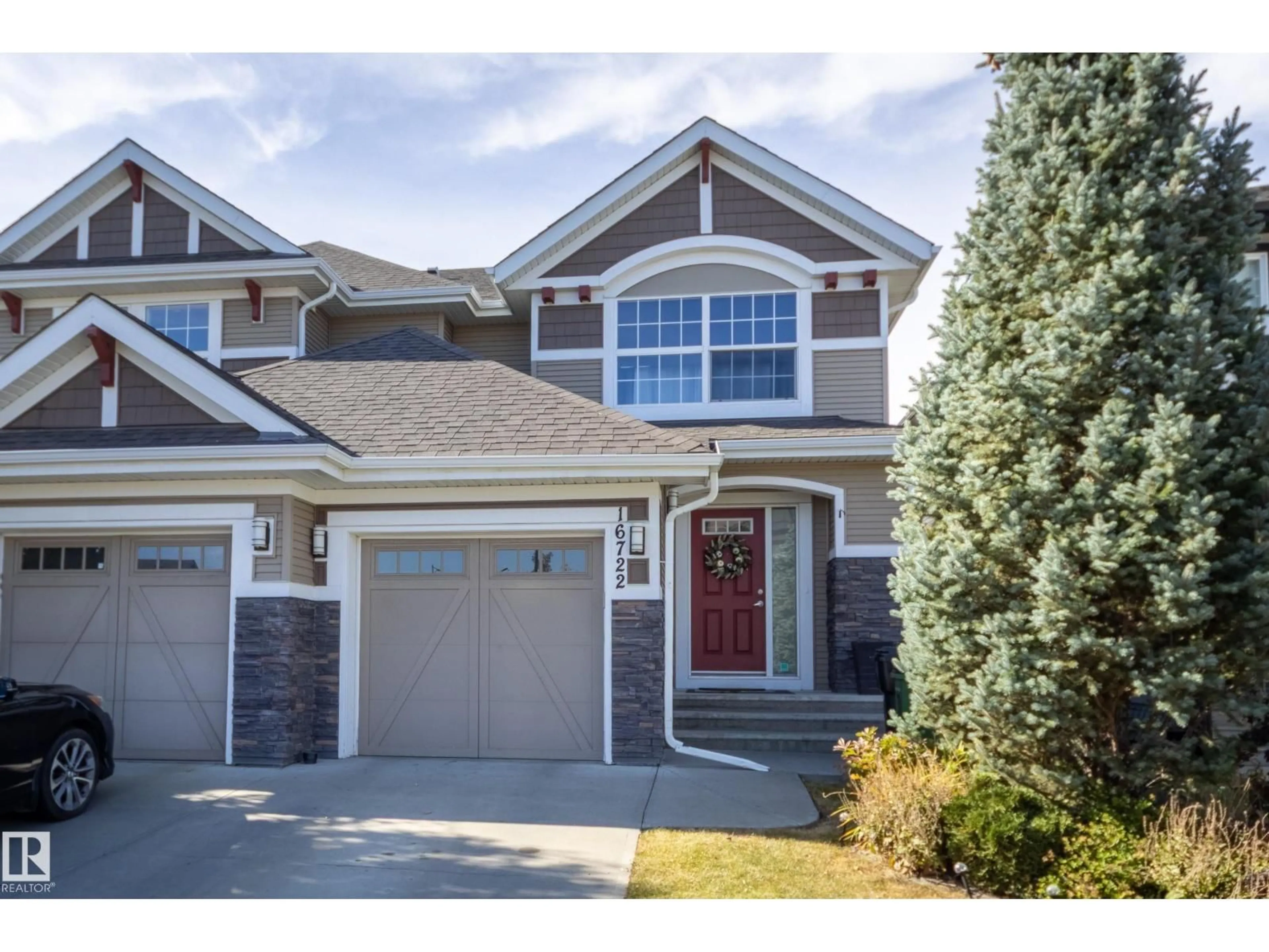 Home with vinyl exterior material, street for NW - 16722 64 ST, Edmonton Alberta T5Y3P8