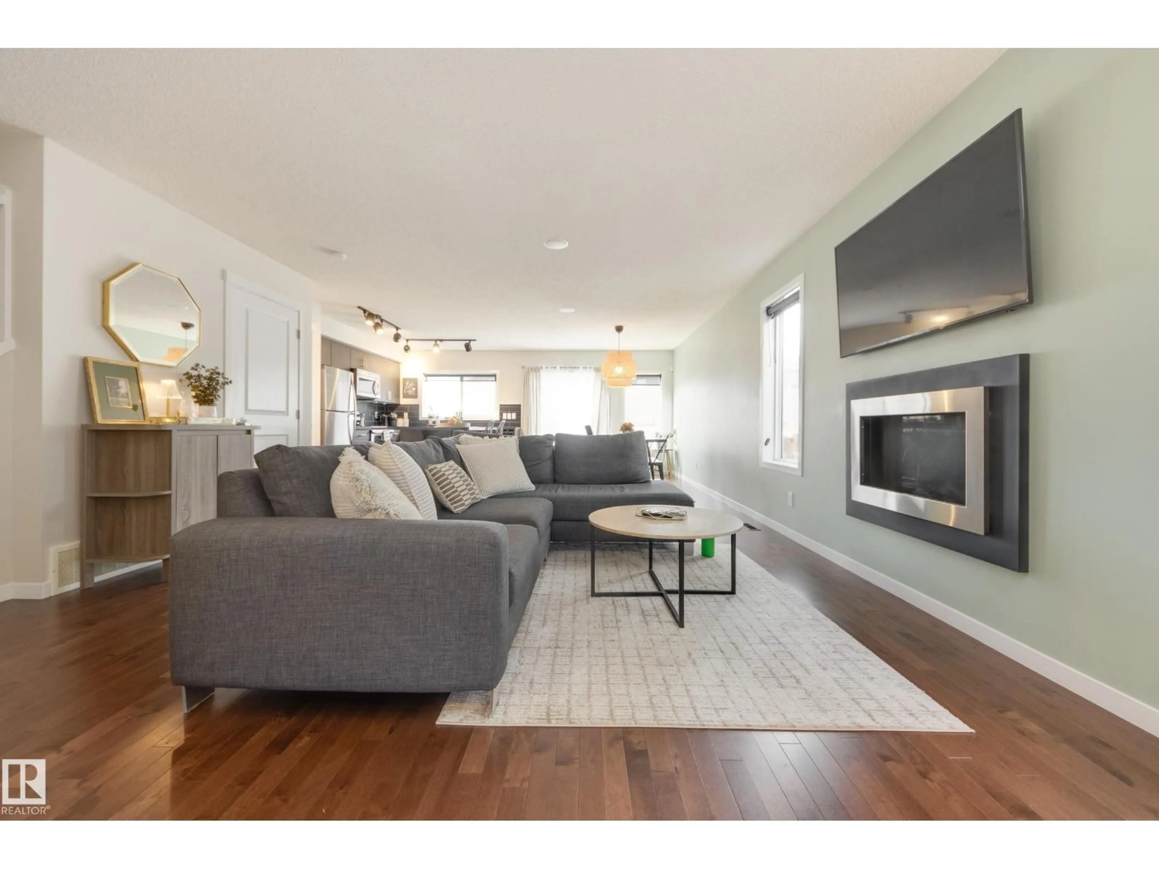 Living room with furniture, wood/laminate floor for NW - 16722 64 ST, Edmonton Alberta T5Y3P8