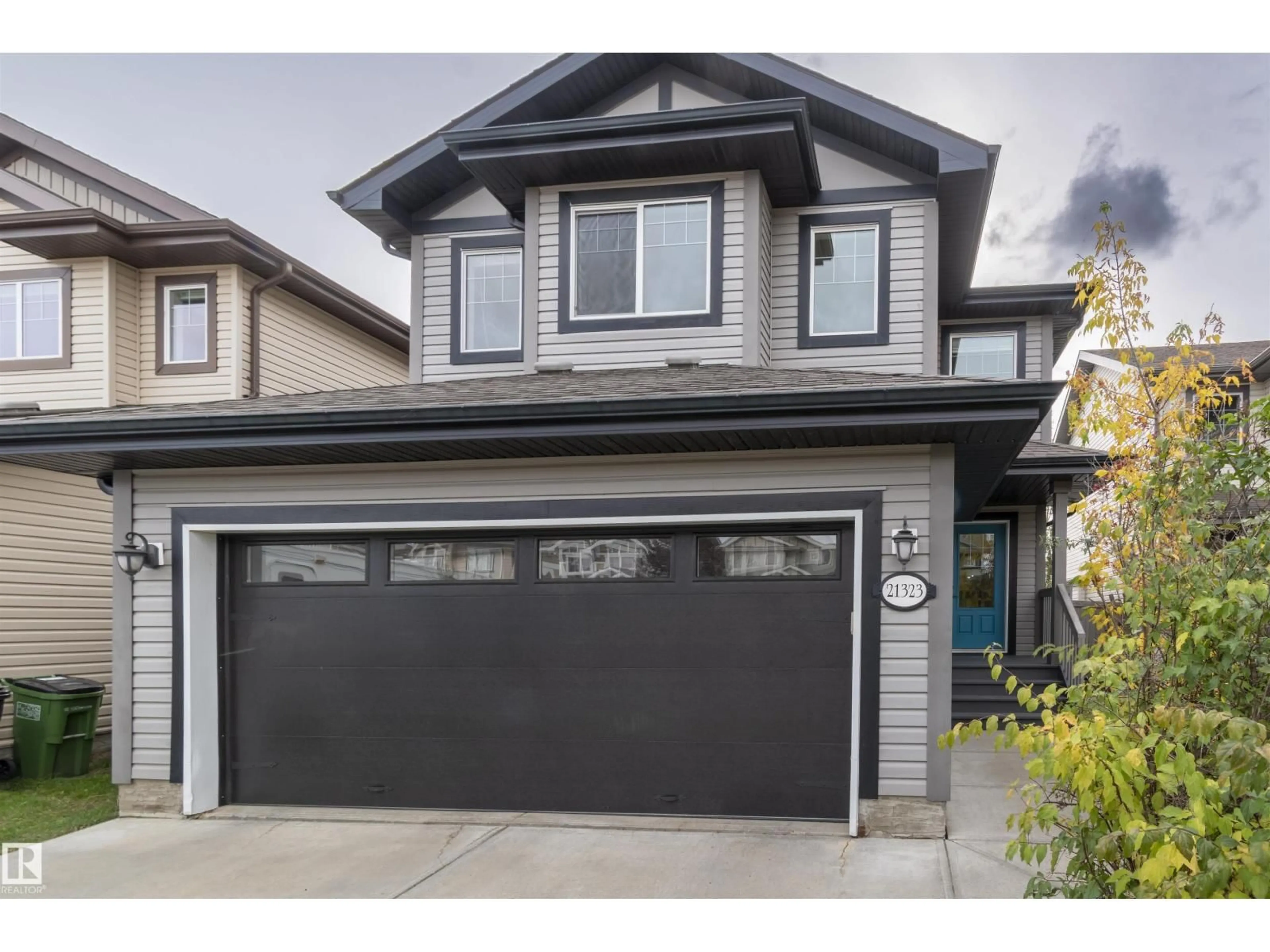 Home with vinyl exterior material, street for NW - 21323 58 AV, Edmonton Alberta T6M0H4