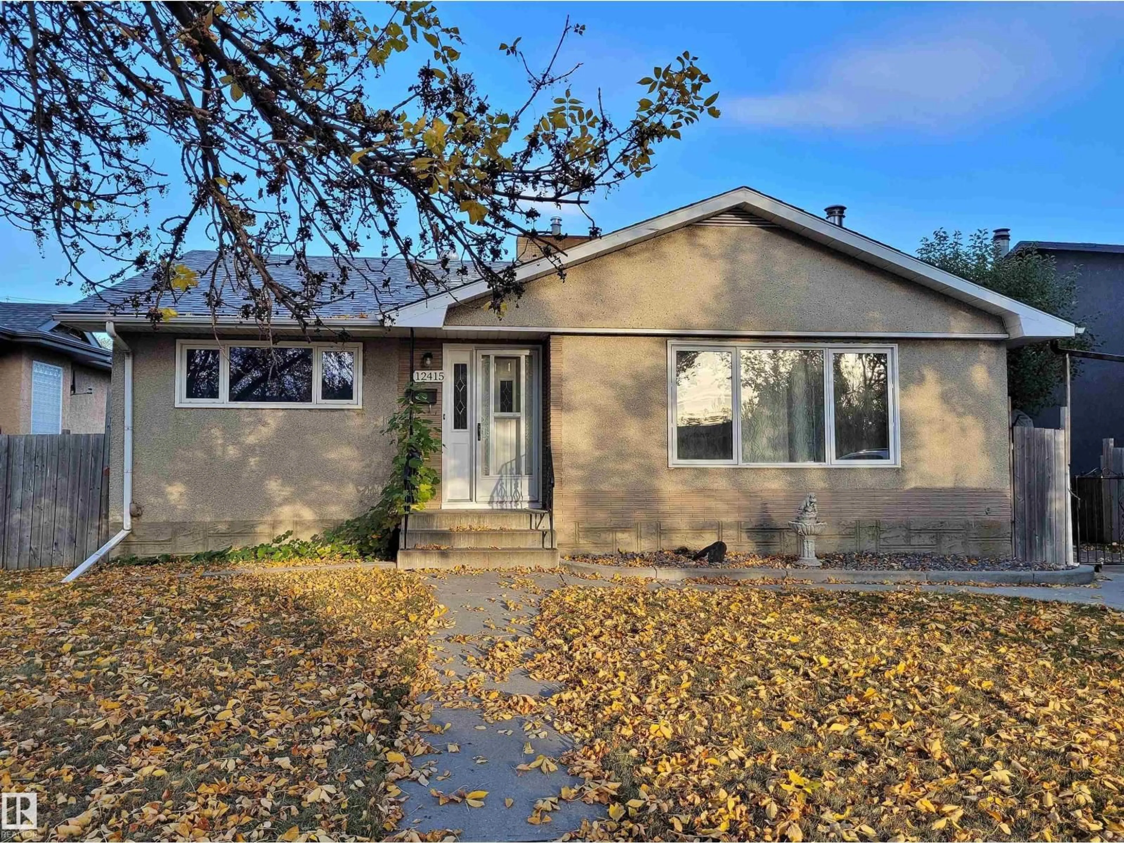 Home with vinyl exterior material, street for NW - 12415 80 ST, Edmonton Alberta T5B2P8