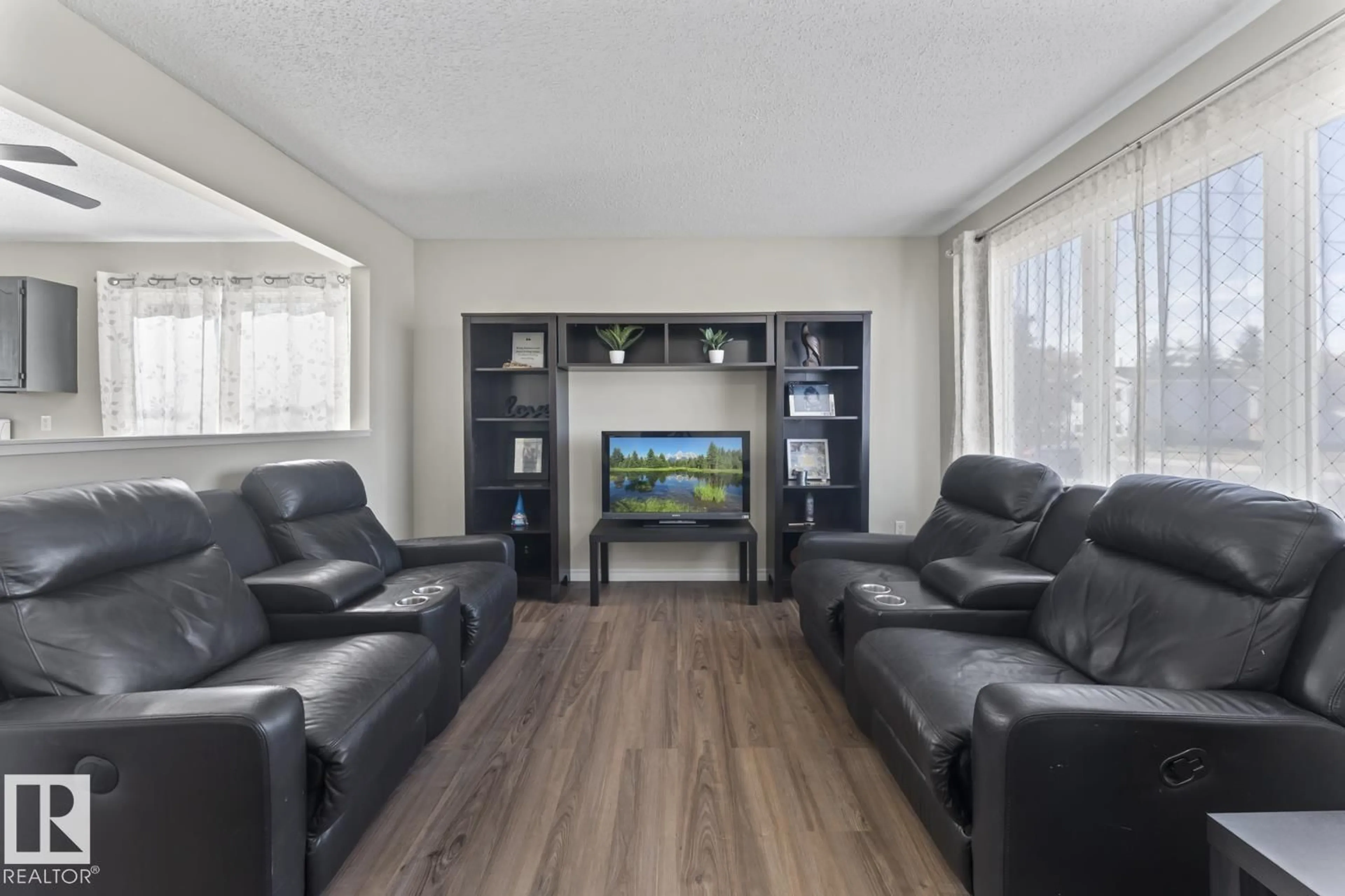 Living room with furniture, wood/laminate floor for 5213 60 ST, Cold Lake Alberta T9M1T4