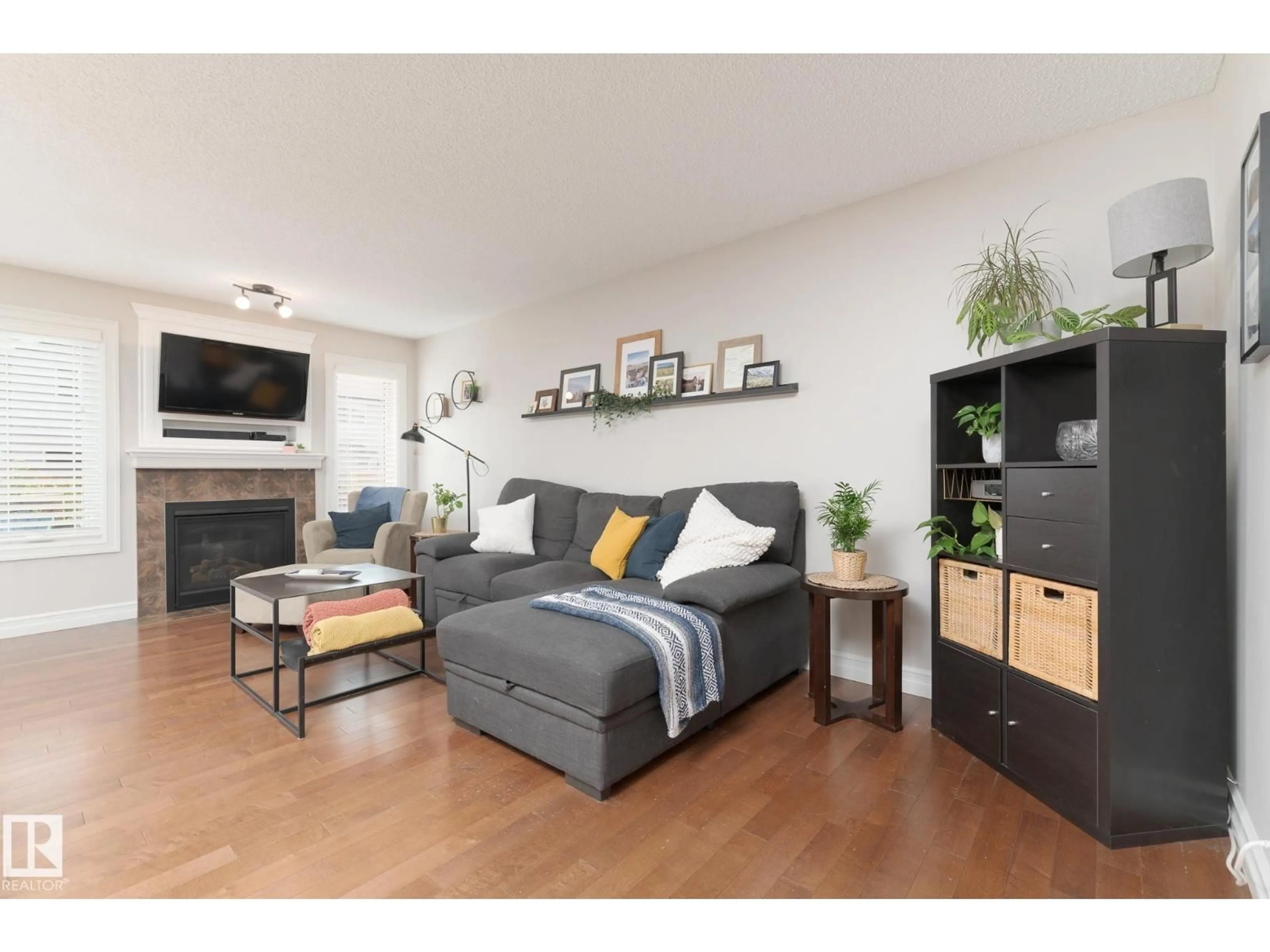 Living room with furniture, wood/laminate floor for 3013 16A AV, Edmonton Alberta T6T0P8