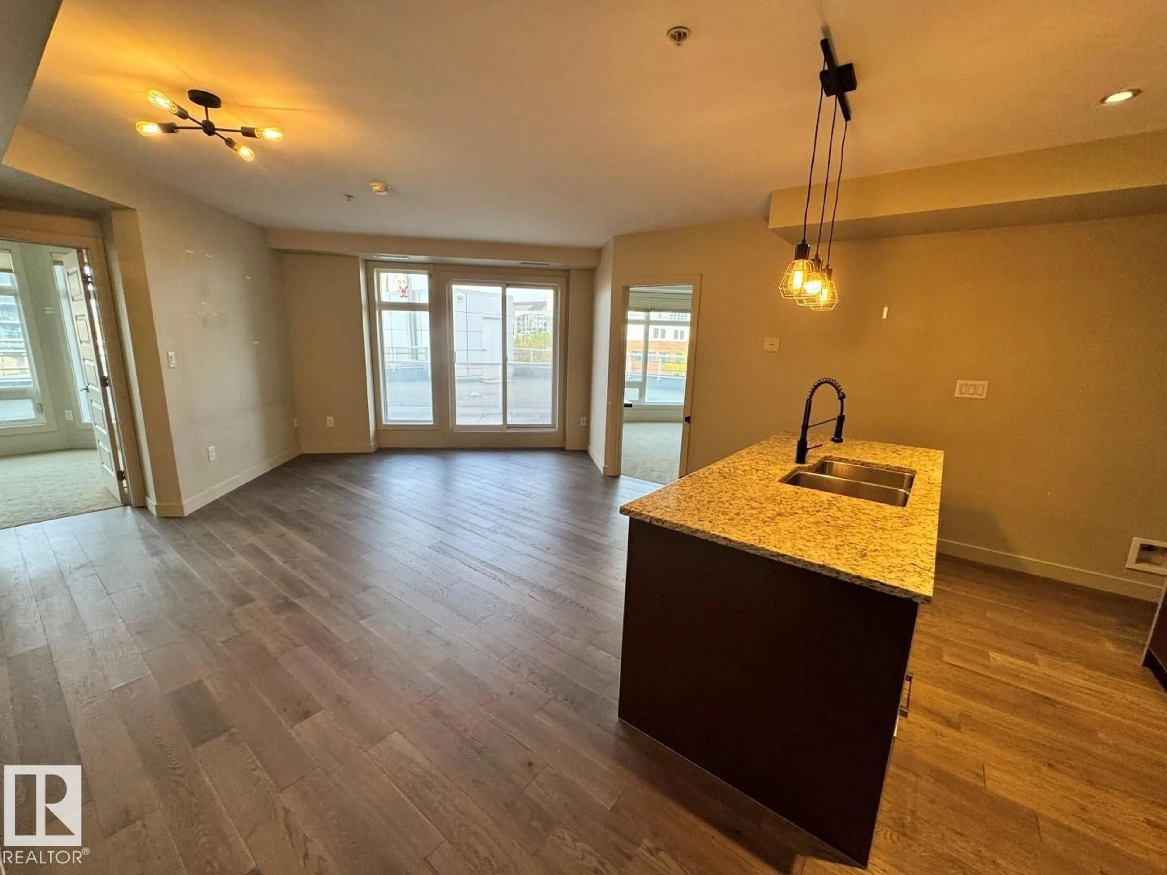 Open concept kitchen, wood/laminate floor for #307 - 10388 105 ST, Edmonton Alberta T5J0C2