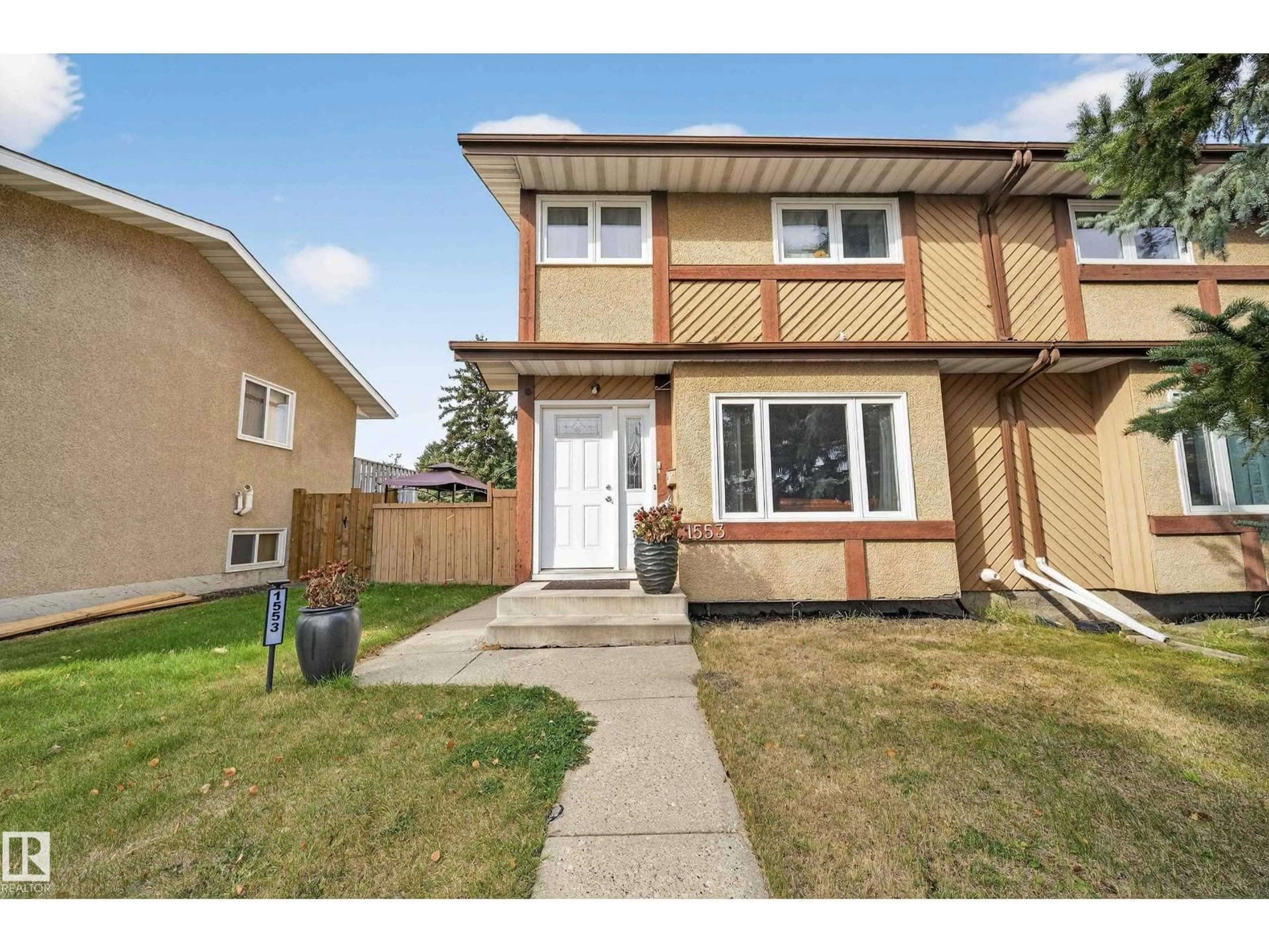 Home with vinyl exterior material, street for 1553 LAKEWOOD RD, Edmonton Alberta T6K2V7