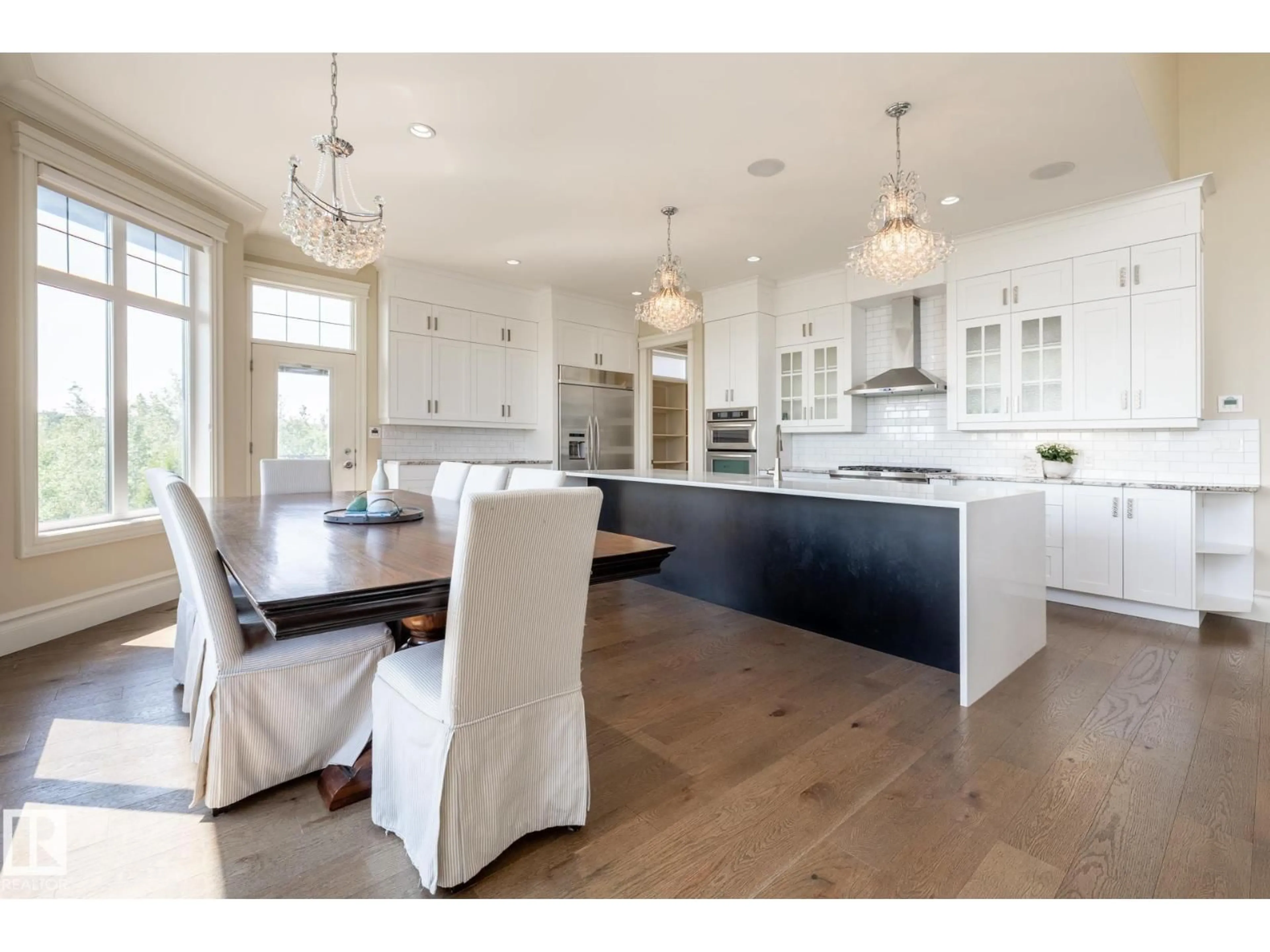Open concept kitchen, wood/laminate floor for 1018 HOLLANDS PT, Edmonton Alberta T6R3T1